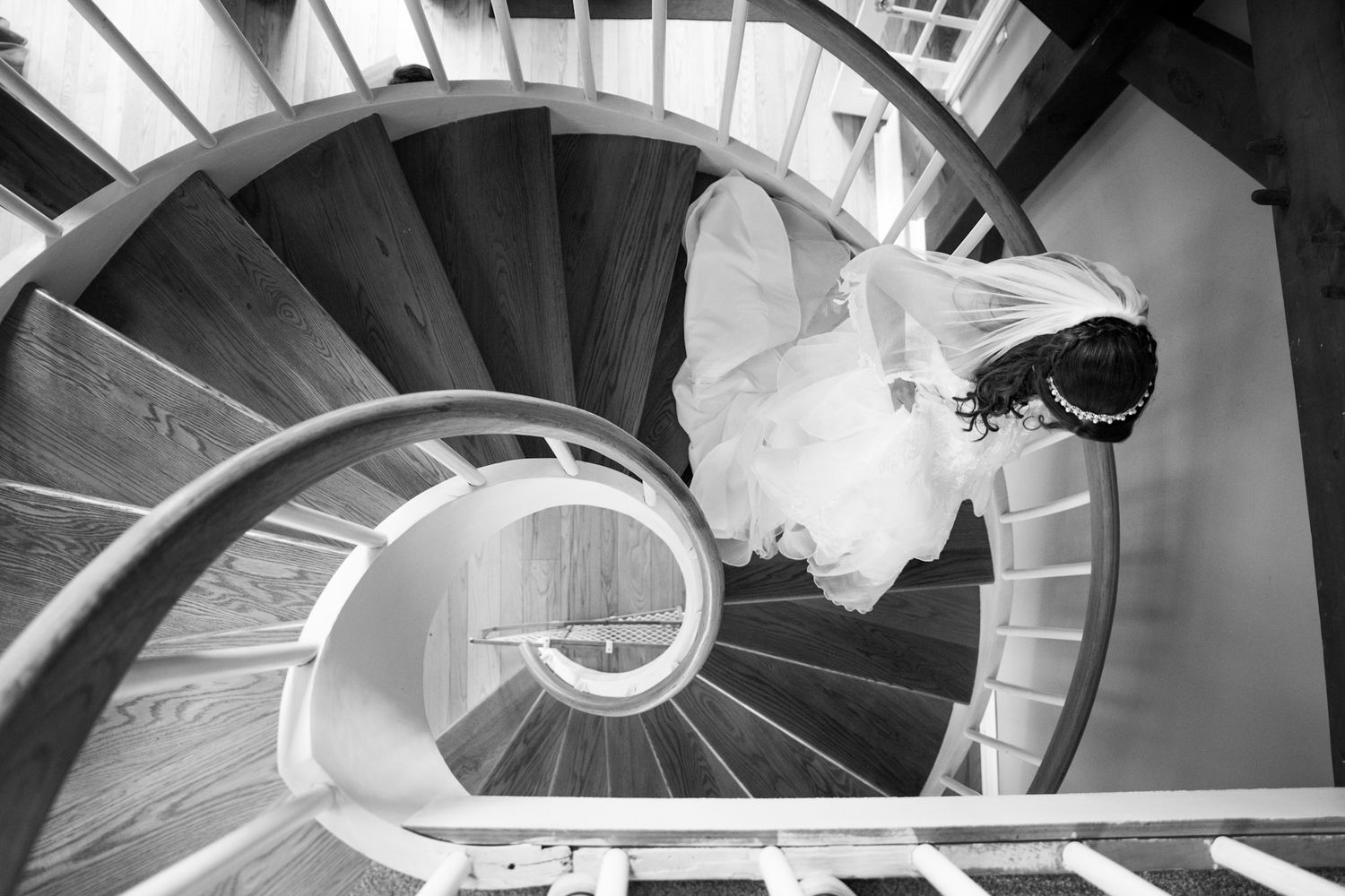 Black and white spiral staircase creates dramatic architectural pattern.