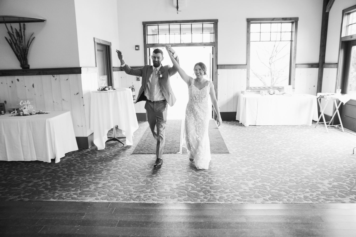 Black and white wedding dance sequence captured in minimalist indoor setting.