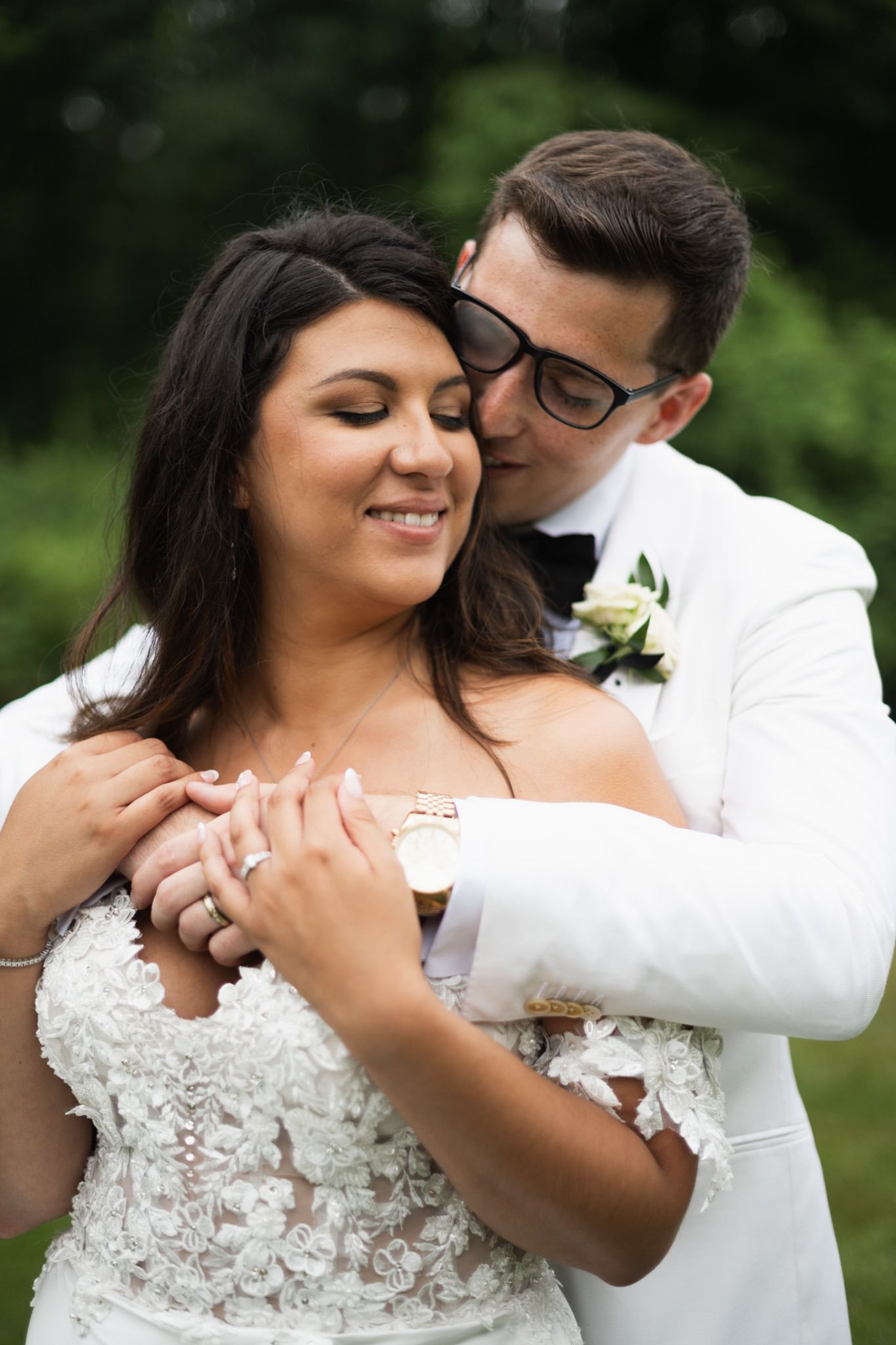 Intimate wedding portrait moments captured in a romantic outdoor garden setting.