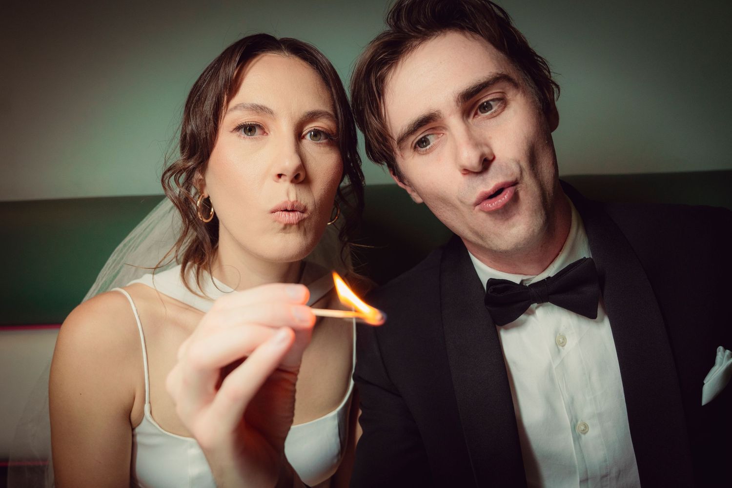 Bride and groom pose in portrait session.