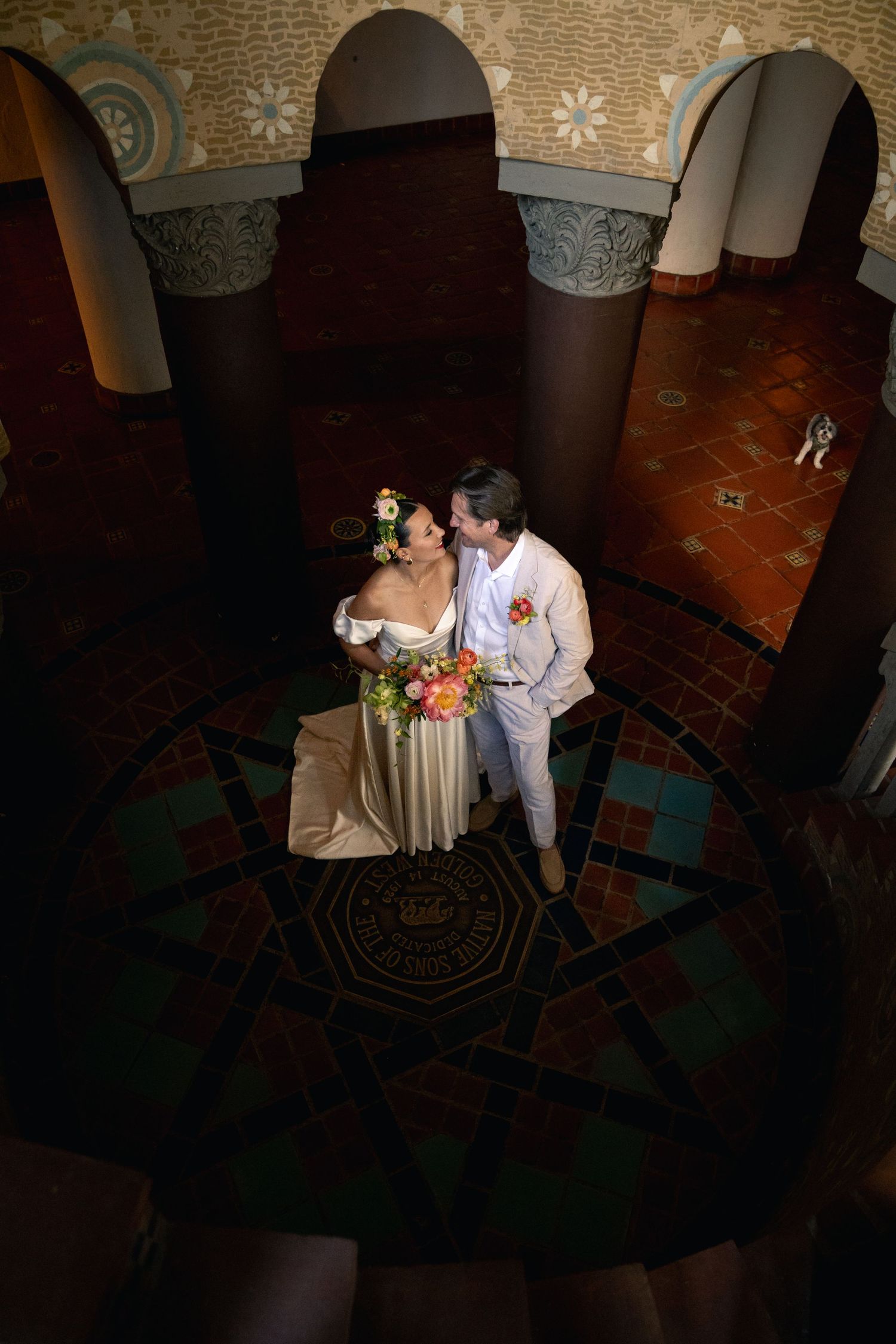 A couple poses during a portrait session at Santa Barbara Courthouse shortly before their wedding ceremony.