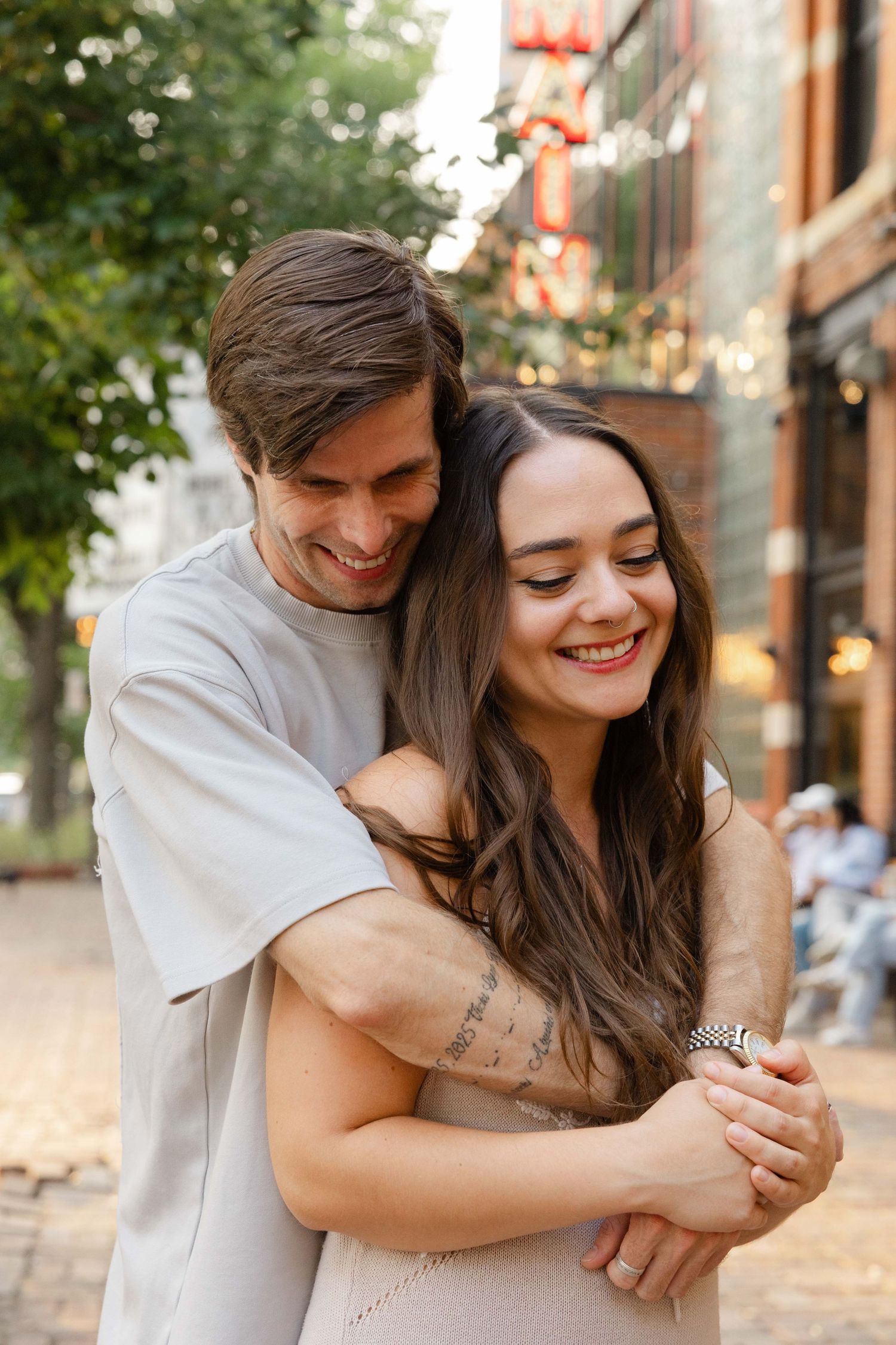 couples session in Minneapolis by by main cinema, golden light, hugging