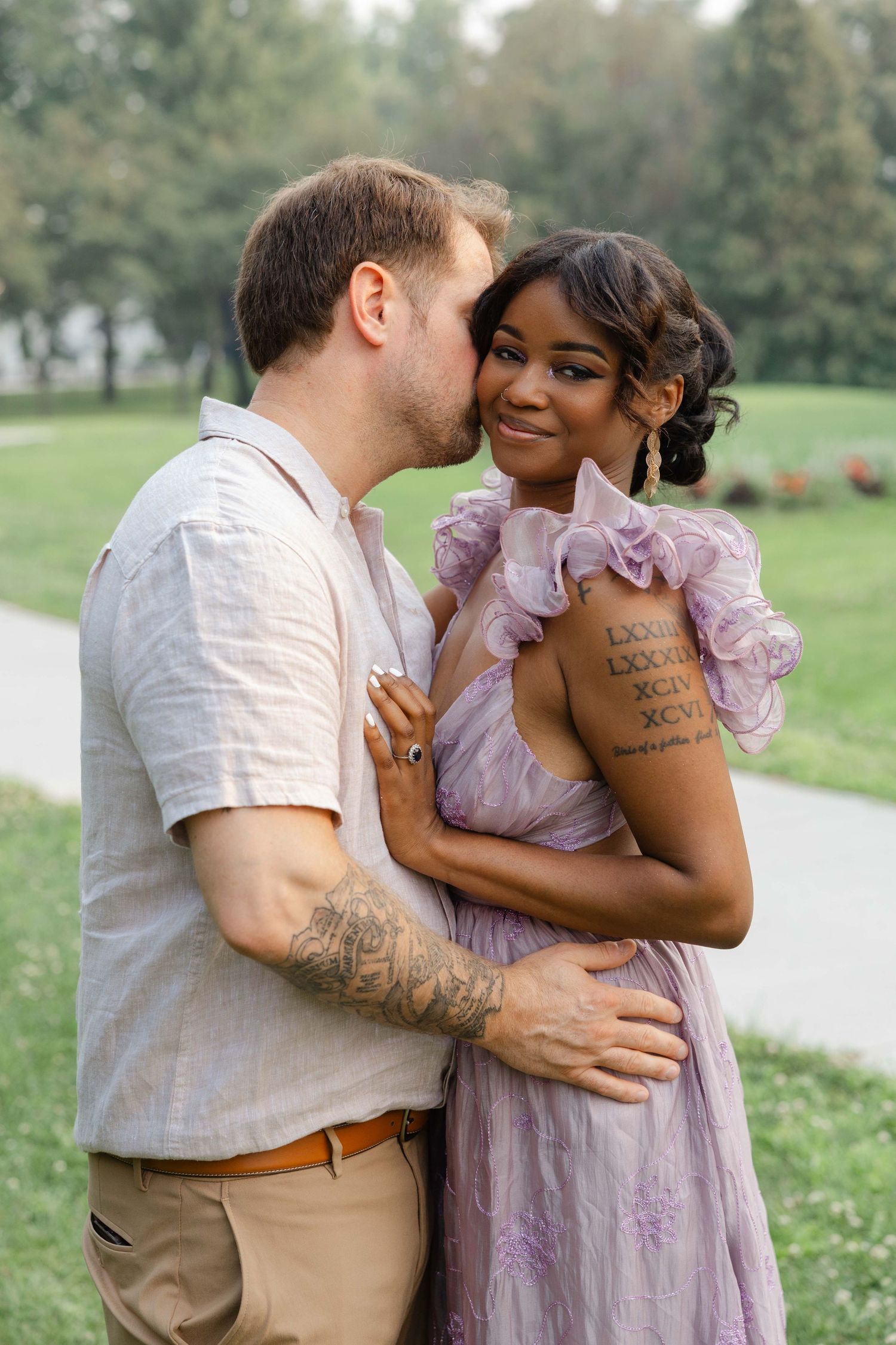 engagement session of a couple, kissing in a arnerson park in Edina, MN