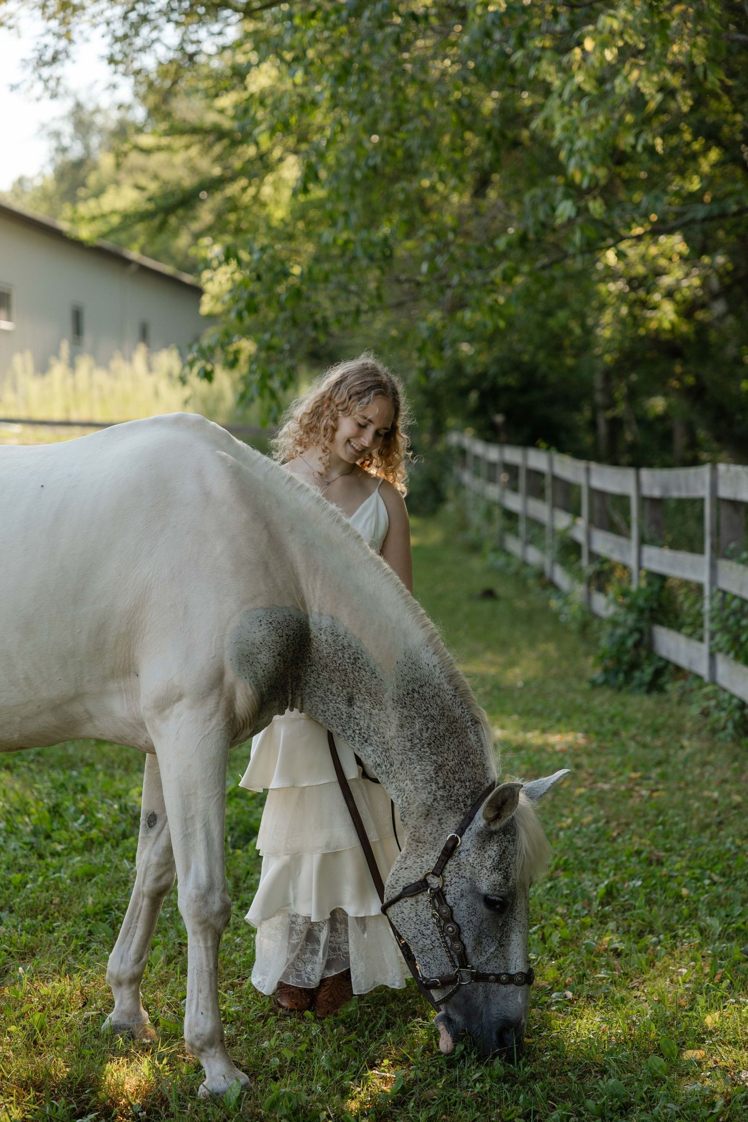 high school senior posing with a horse