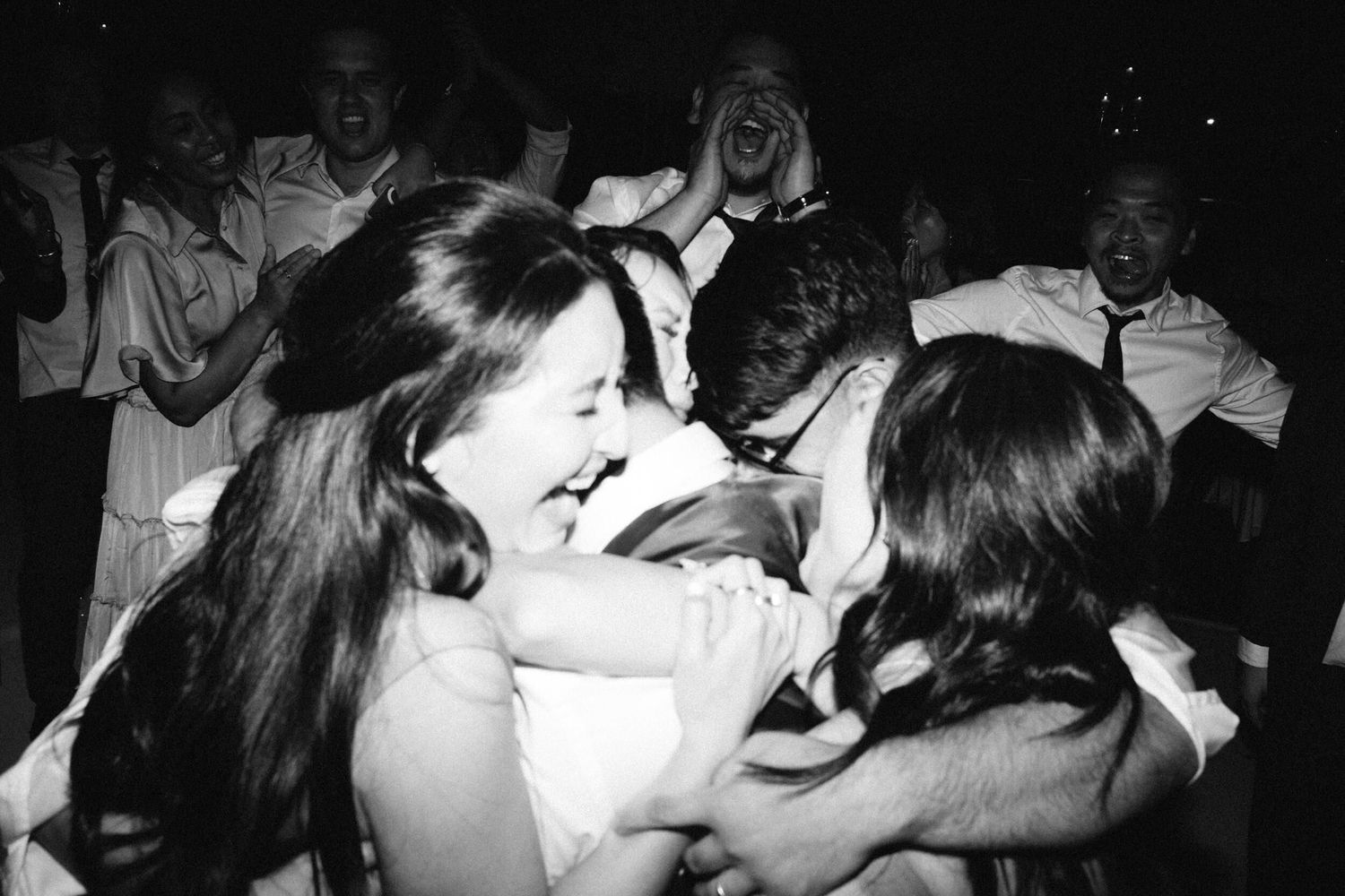 Emotional last song at the wedding, guests rushing to hug the bride and groom in tears of joy at Leonda by the Yarra, Melbourne.