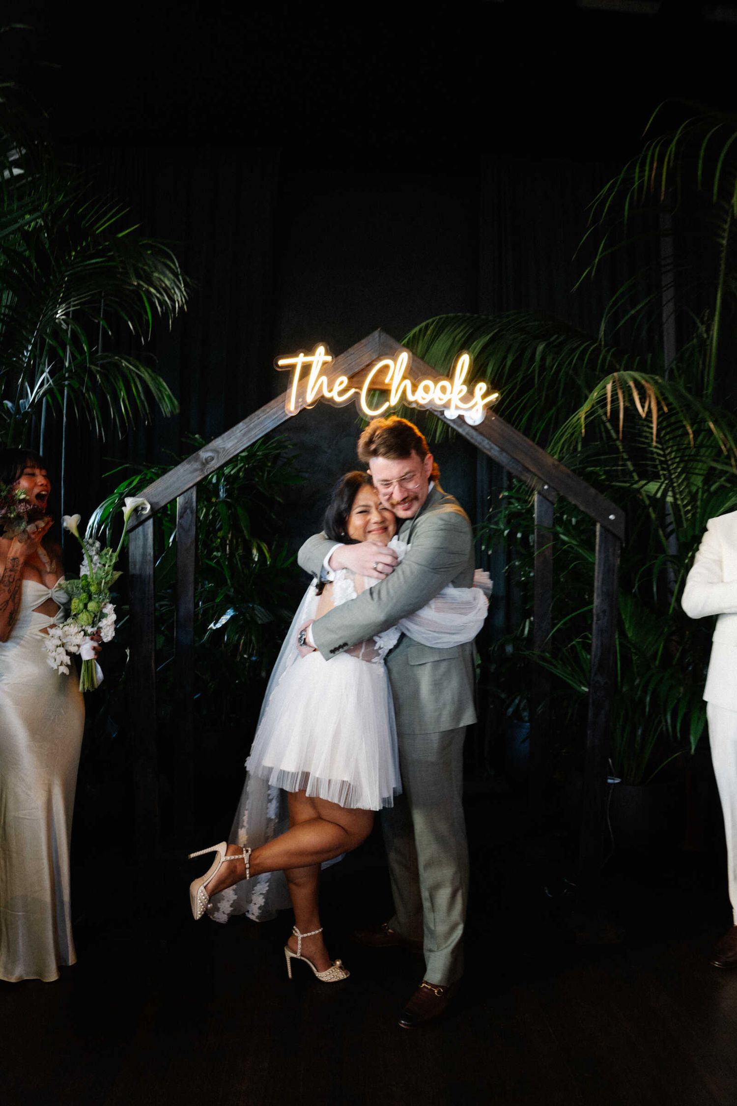 isabelle and andrew hugging at the alter during the ceremony held at glasshaus brucke, richmond, melbourne.