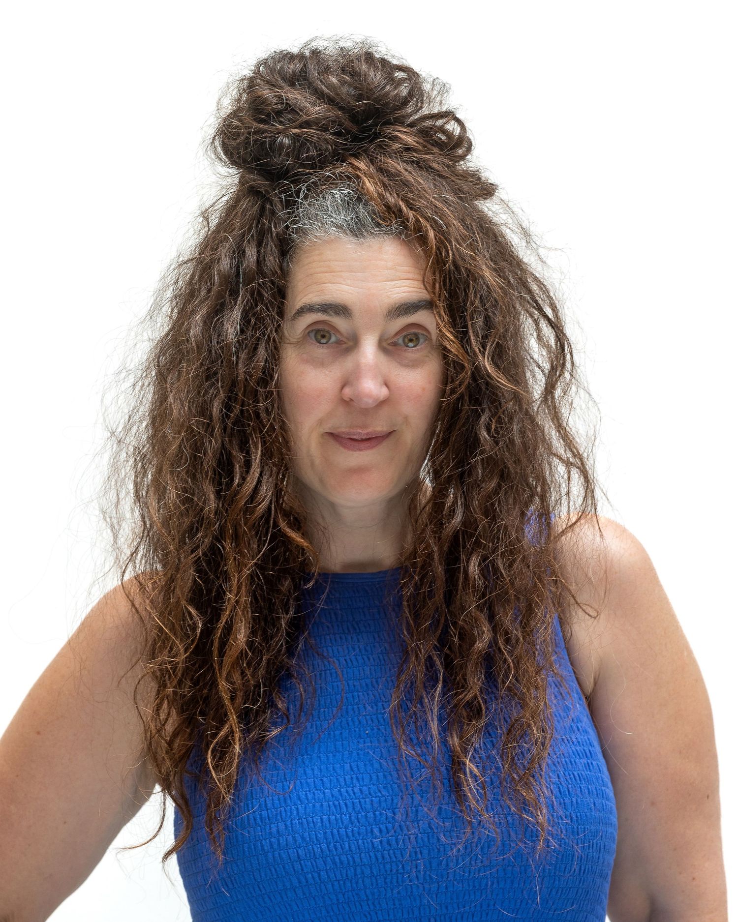 A portrait series of endearing candid expressions in an electric blue sleeveless top with curly brown hair.