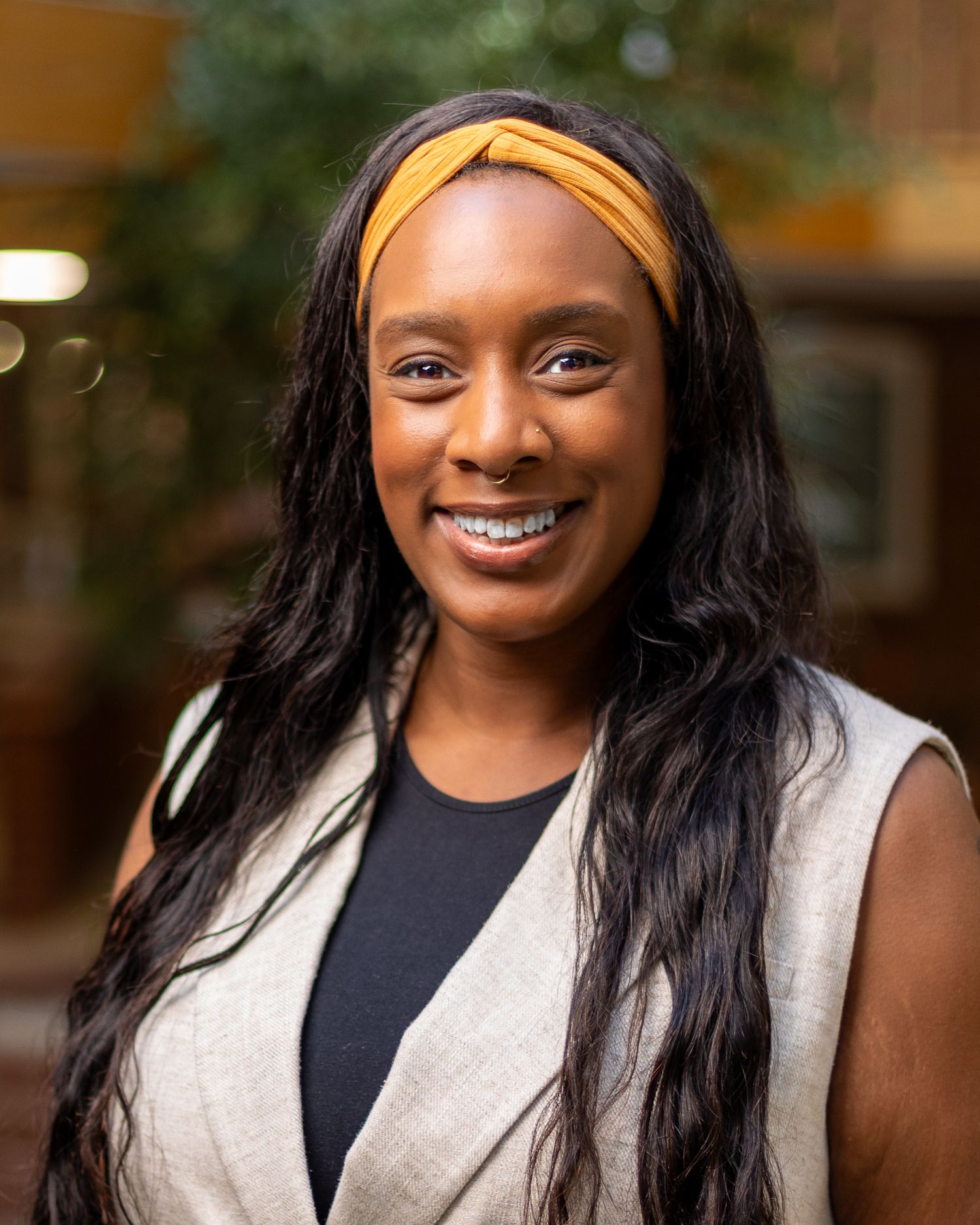Professional headshots showing warm expressions and confident poses in a studio setting.