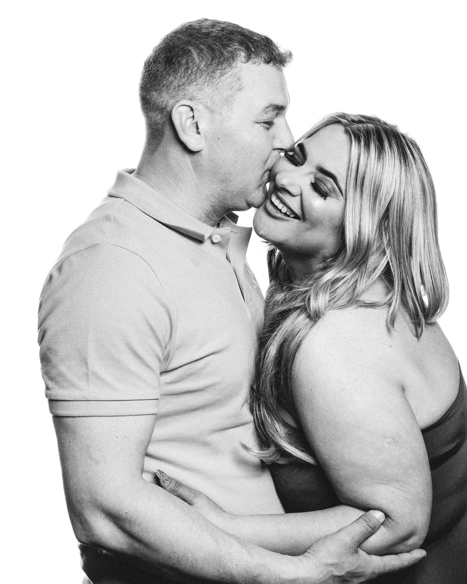 Series of intimate black and white portraits showing a couple in loving embraces.