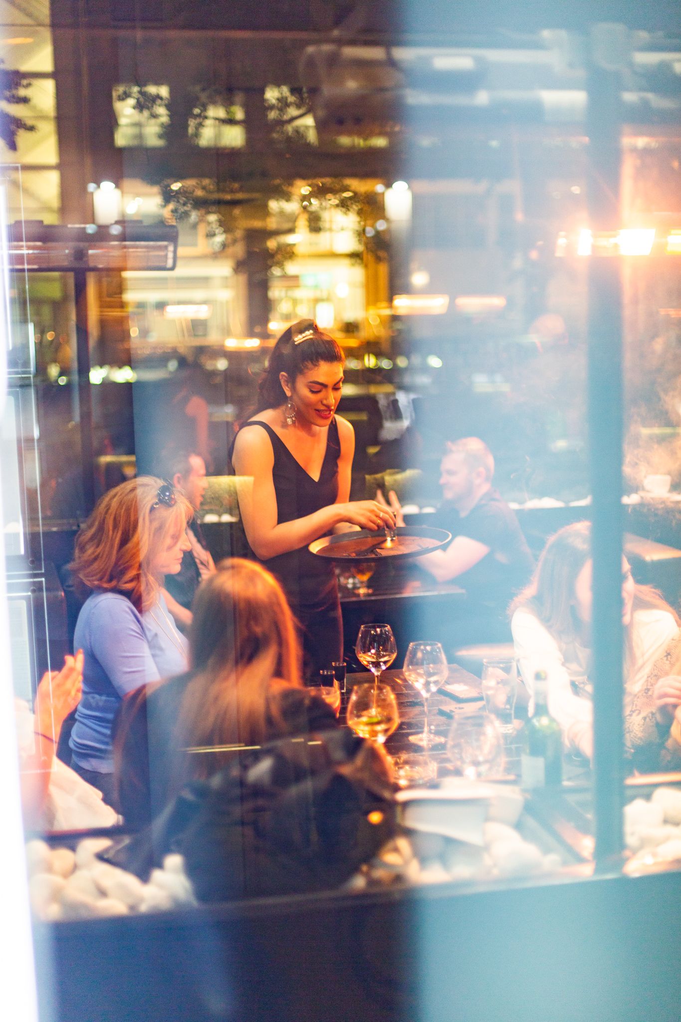 high end wine bar waitress serving drinks