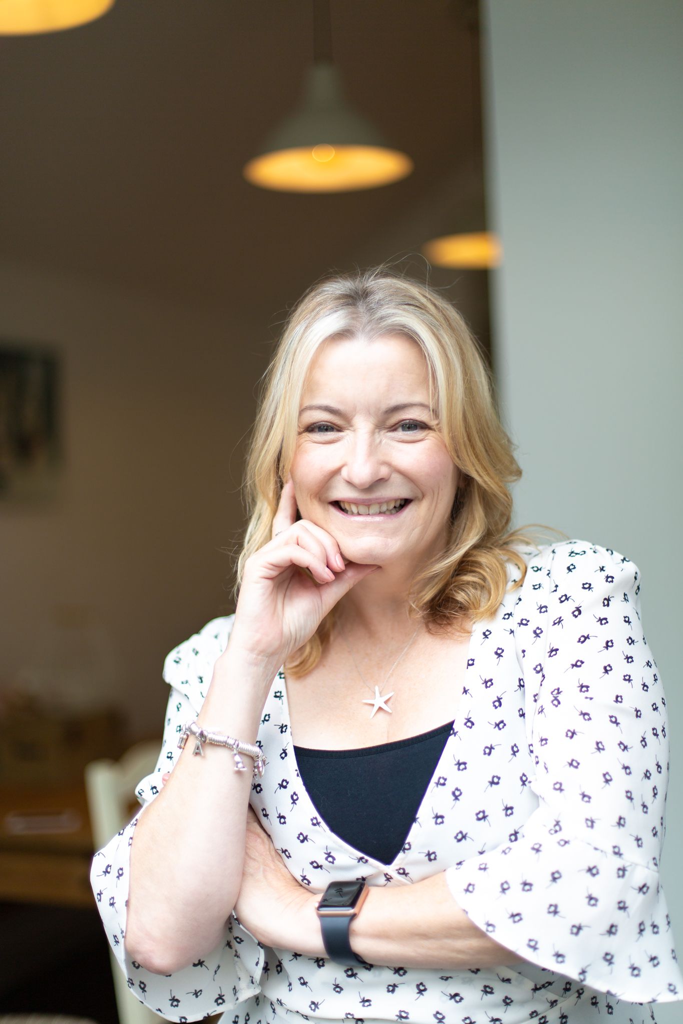 female professional at work looking at camera smiling at work