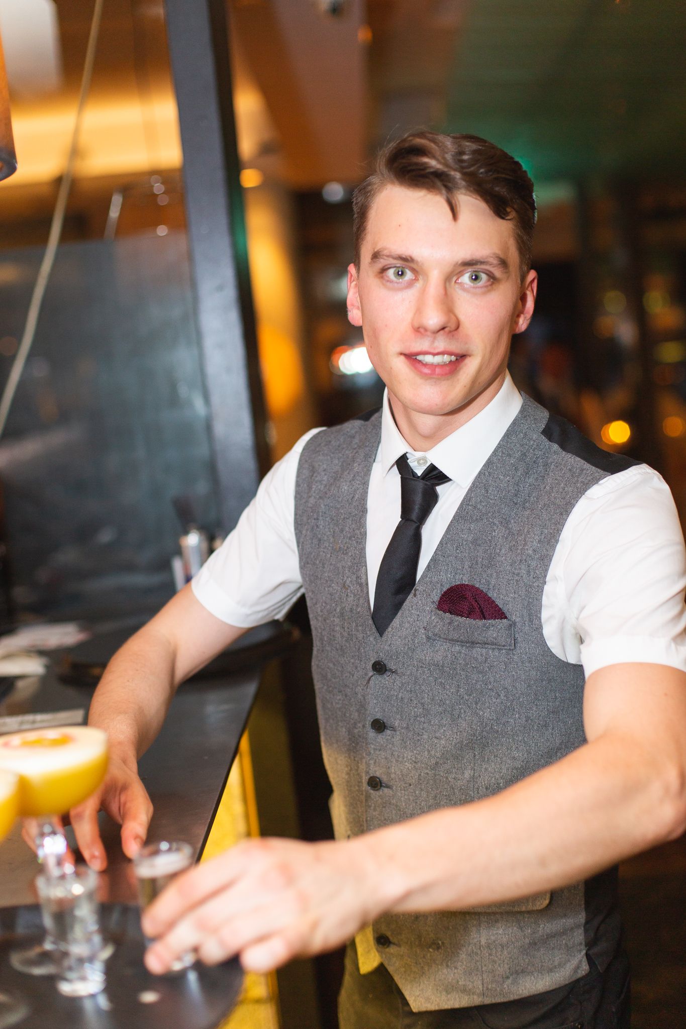 barman sorting drinks at highend winebar