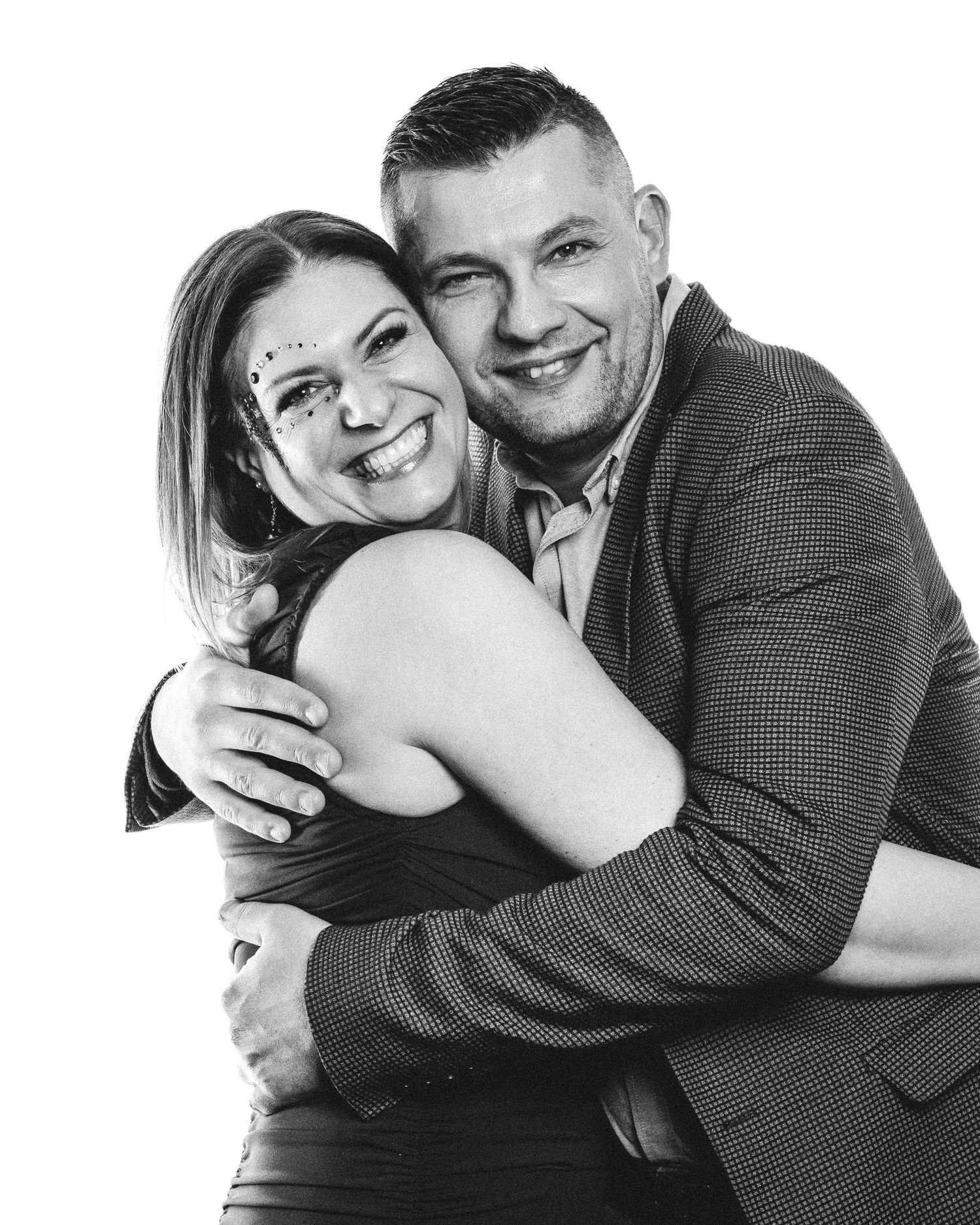 Black and white portraits capturing tender moments between a couple in casual attire.