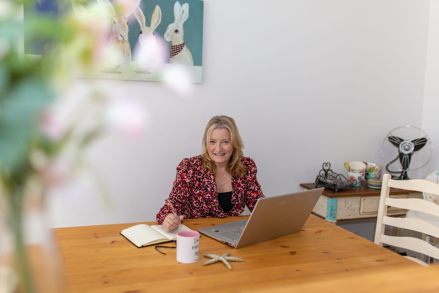 professional woman writing emails in her home office
