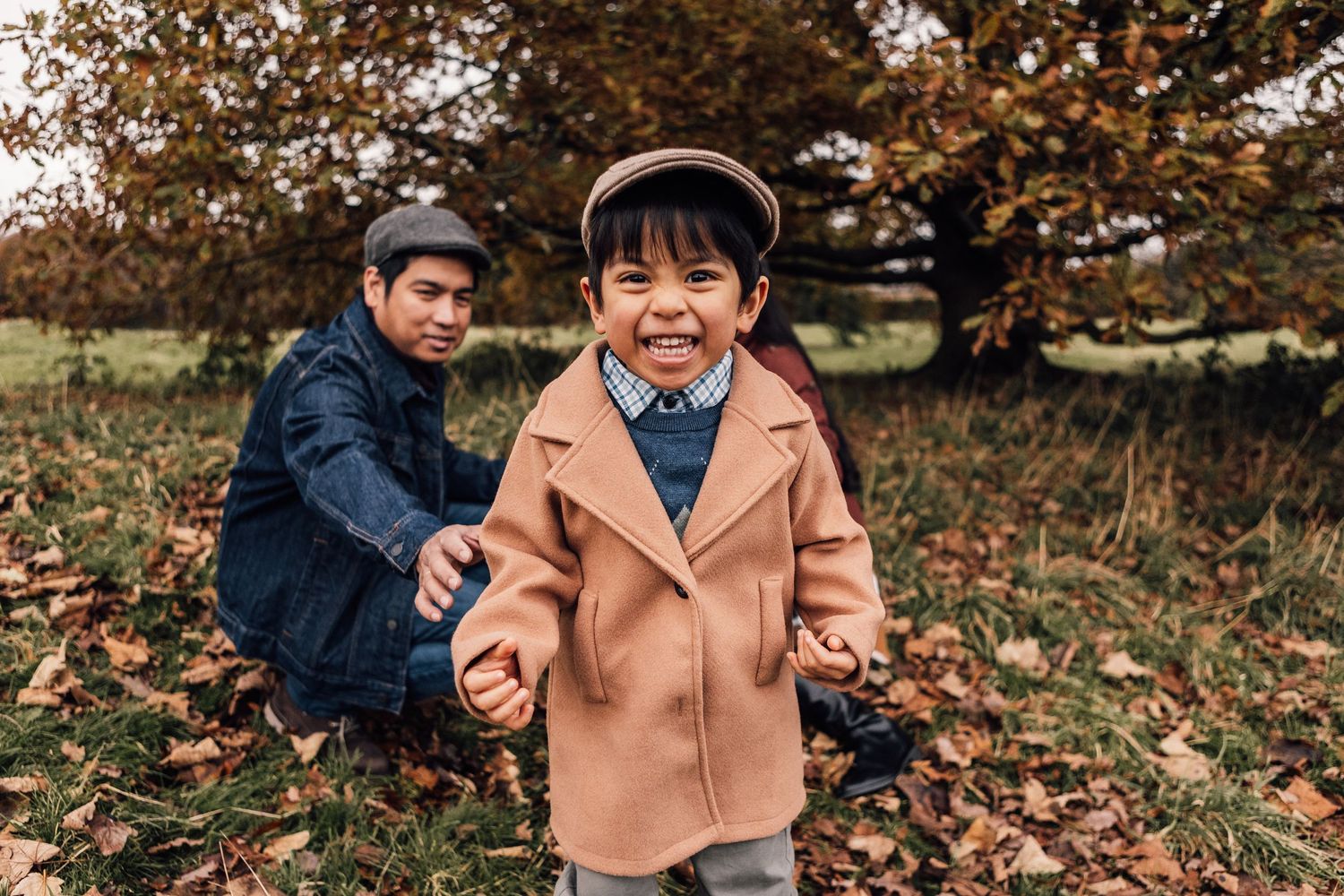 Five connected photos show a cozy fall scene with people enjoying the autumn leaves in a park.