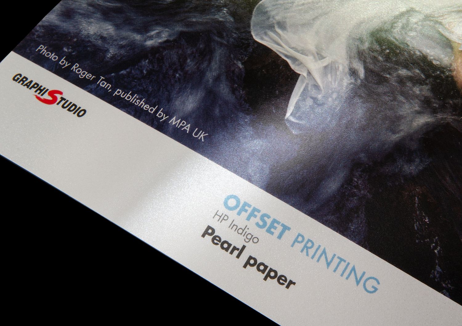 Close-up shot of a printing paper label with smoke or mist effect against dark background.