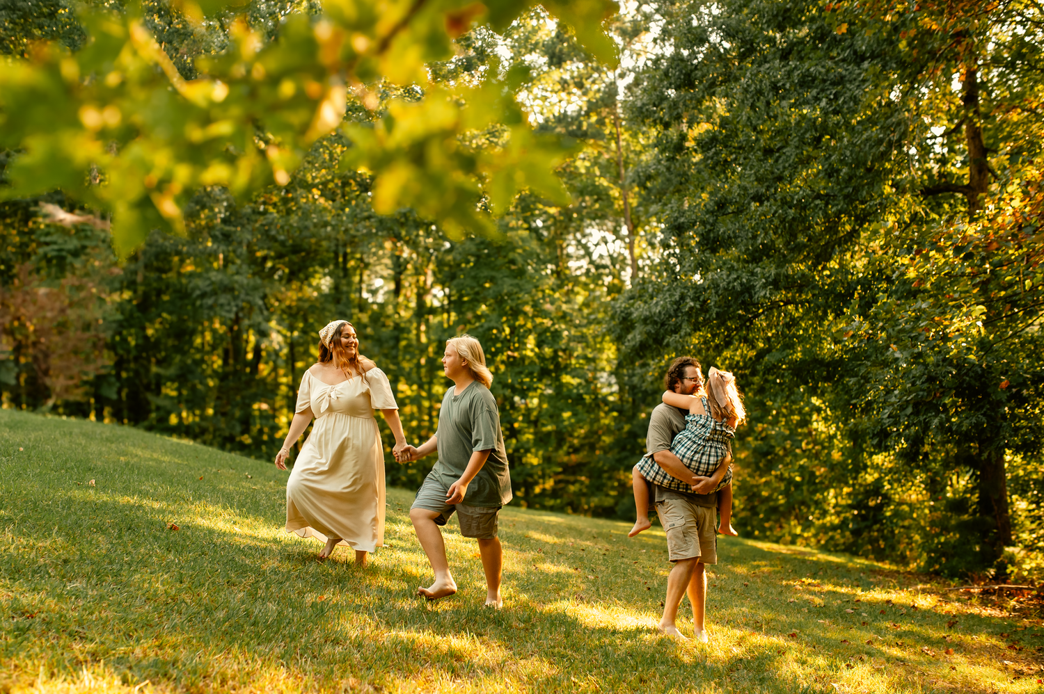 Family playing in the yard for family photos  in Cartersville, GA.