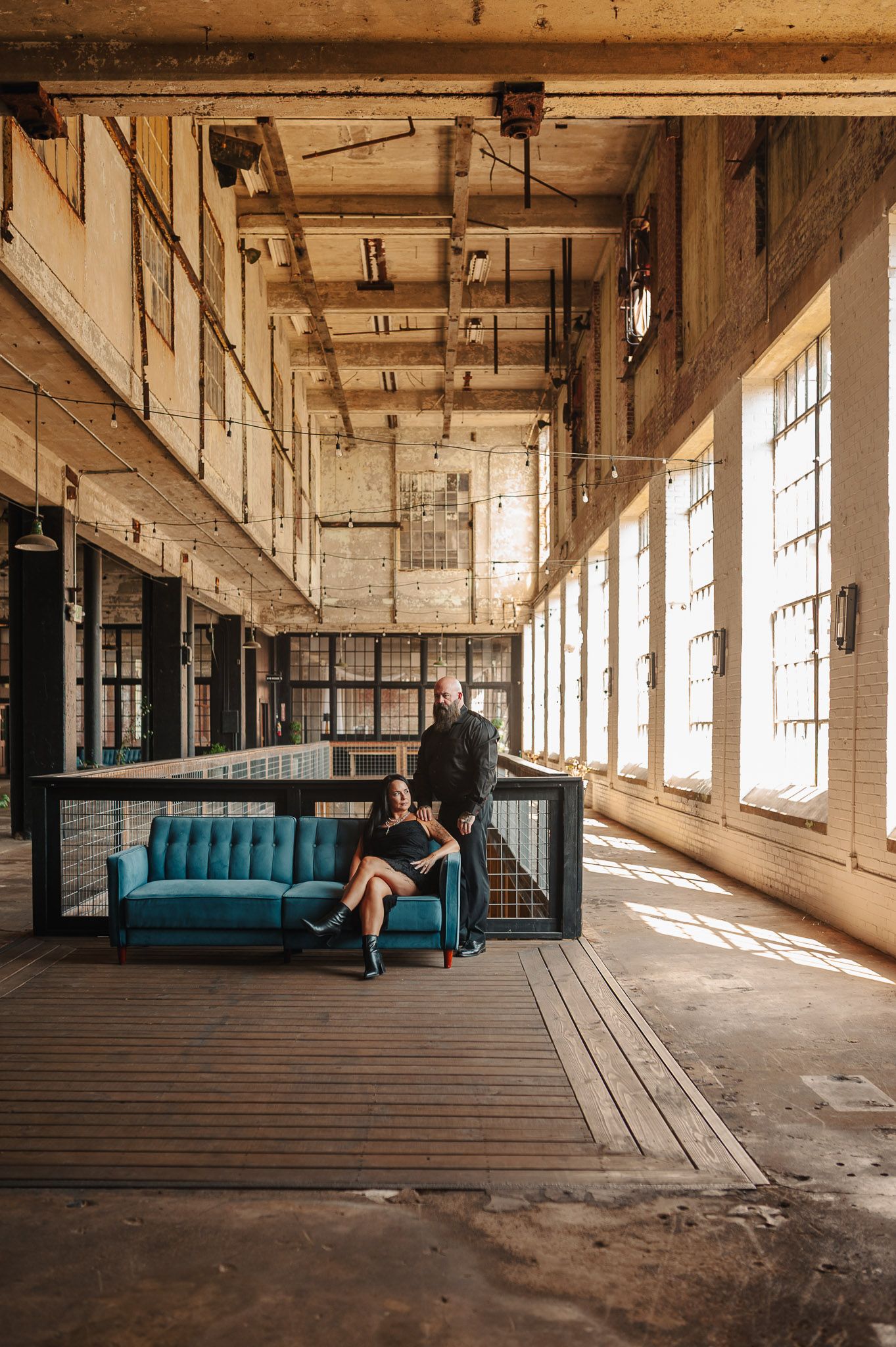 Wide shot of couple in engagement session at industrial Lindale Mill in Rome, GA.