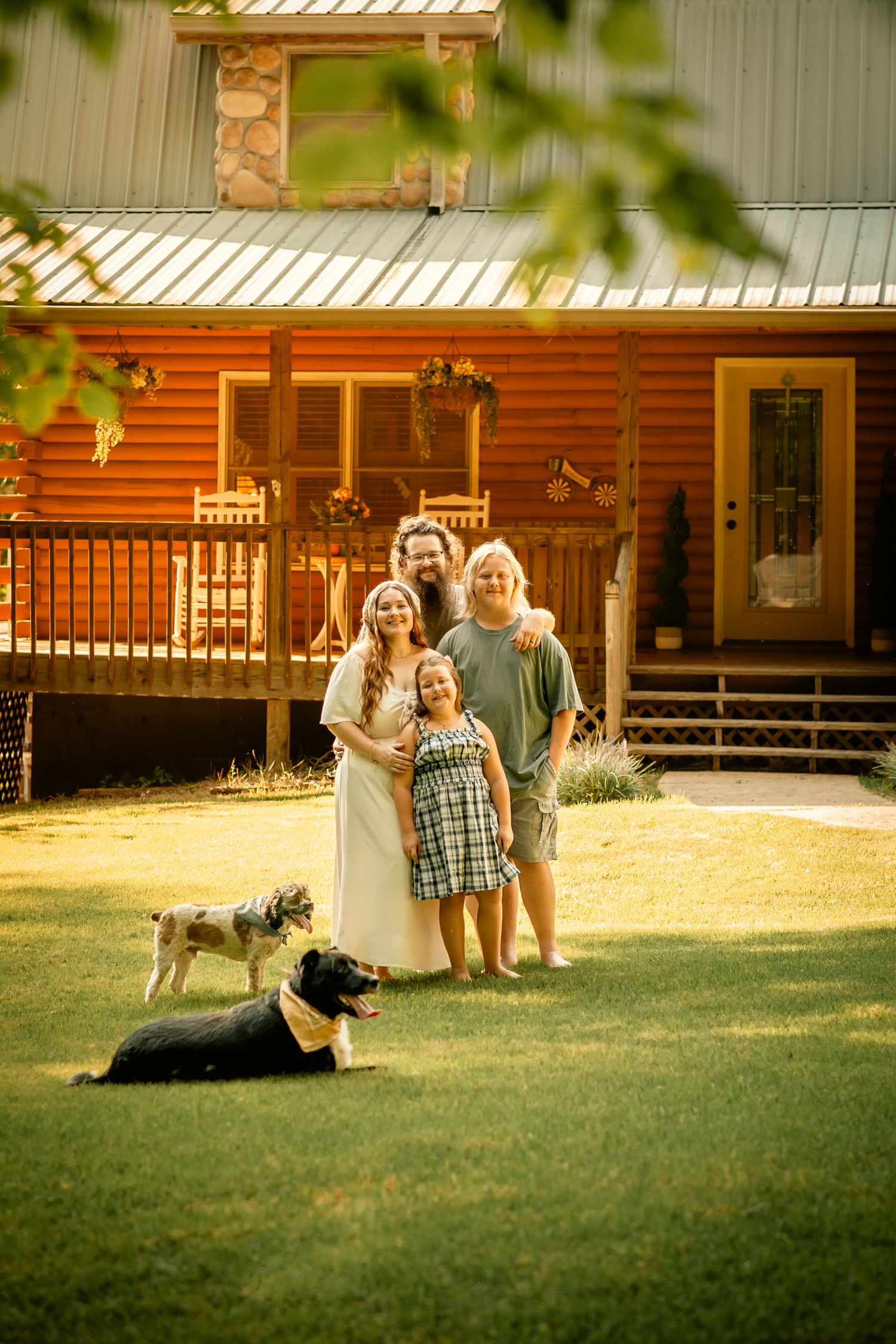 Family posing in front of their house for family photos in Cartersville, GA.