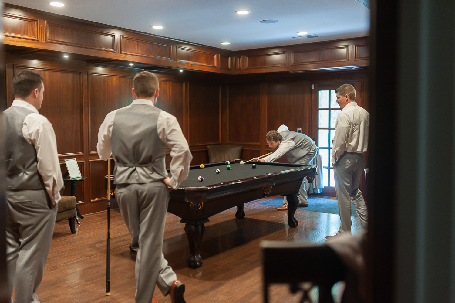 Groom and groomsmen playing pool before the ceremony in West Georgia.