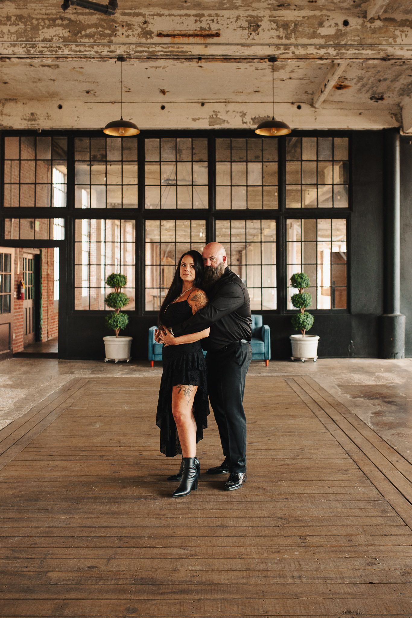 Leading lines to couple in engagement session in industrial Lindale Mill, GA.