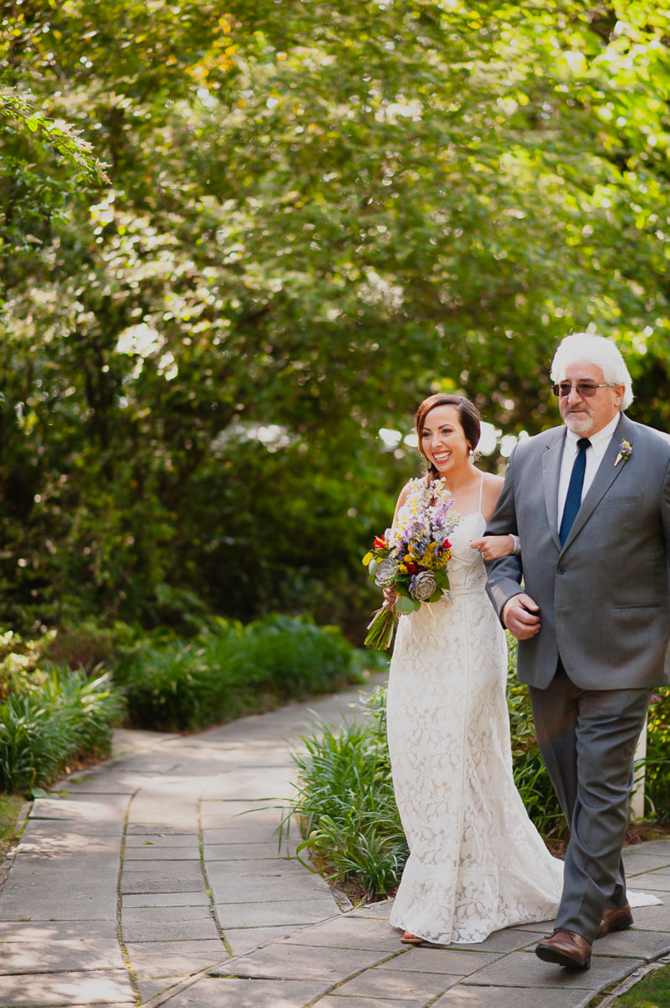 Bride and father walking down the aisle in spring wedding in Atlanta, GA.