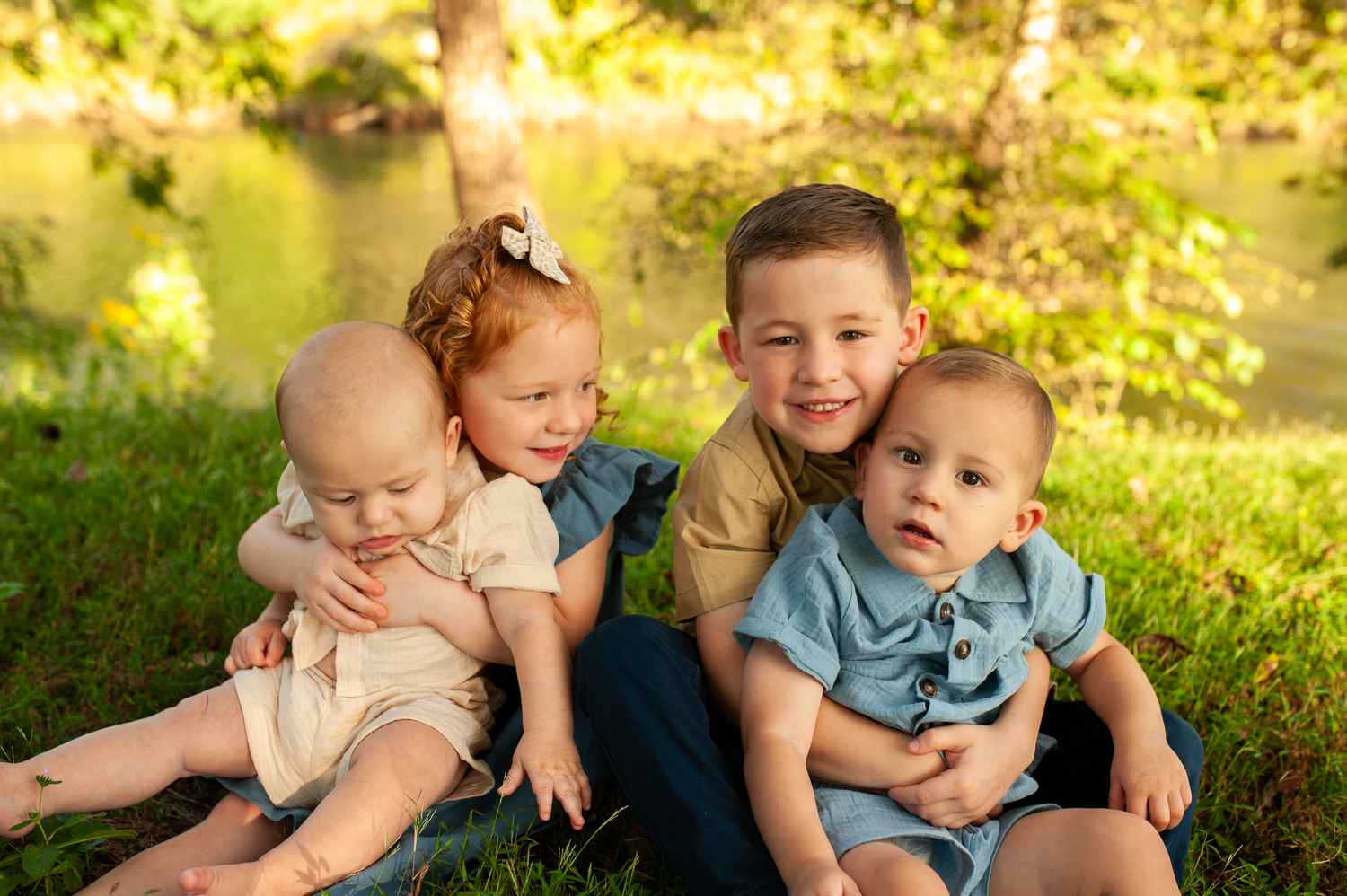 Portrait of 4 kids together in fall family portraits in Cartersville, GA.
