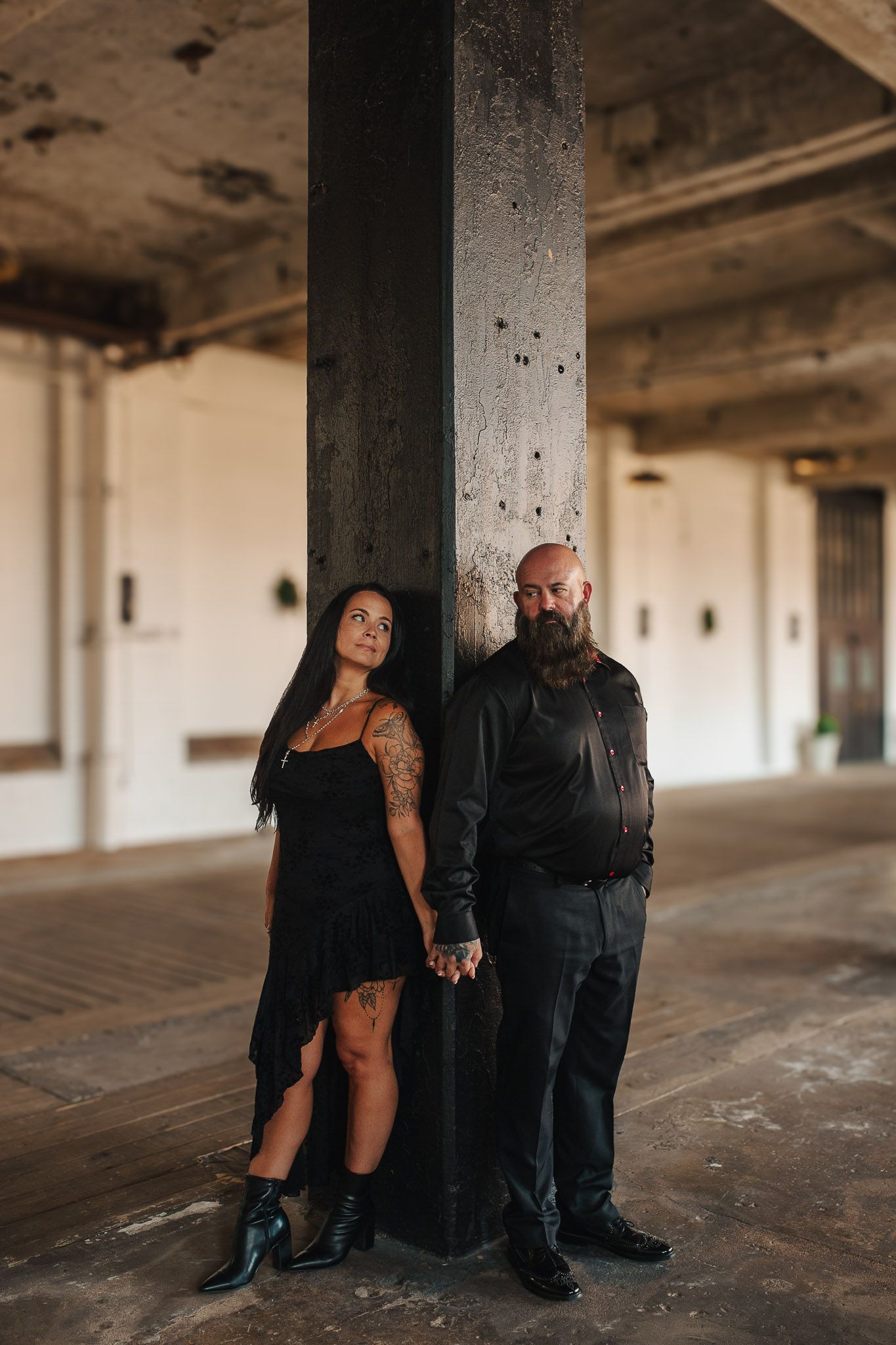 Couple posing holding hands in vertical shot in Lindale Mill, GA.