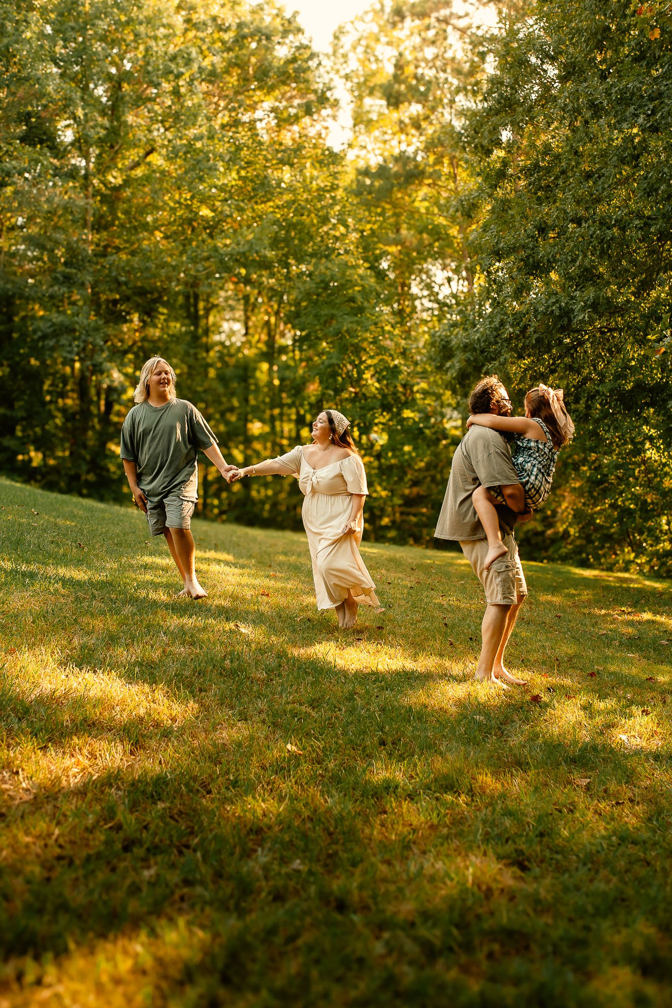 Family playing in the yard for family photos  in Cartersville, GA.