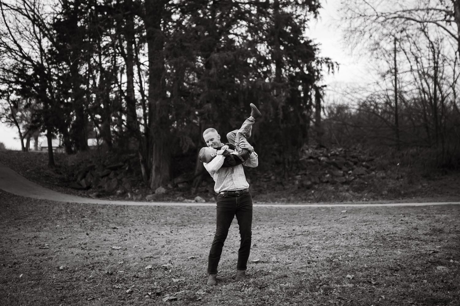 Dad playing with son in family photoshoot in northwest Georgia.