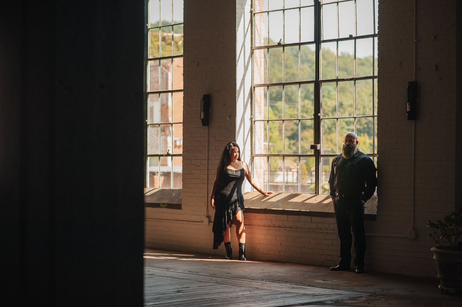 Wide editorial shot of couple in Lindale Mill in Rome Georgia.