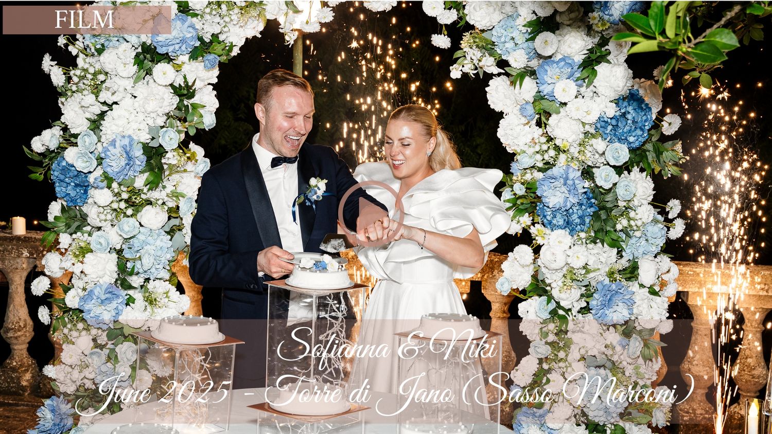 Elegant wedding reception decor with blue and white floral arrangements and sparkling lights creating a romantic atmosphere.