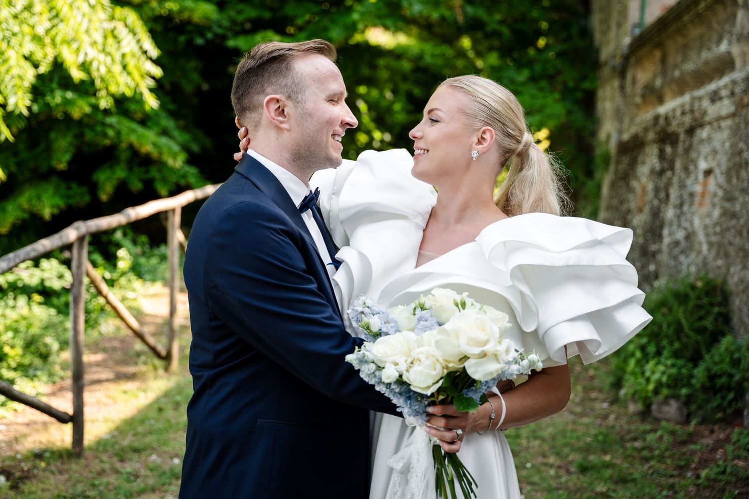 Wedding photos showcase multiple romance-filled moments in an outdoor garden setting with lush greenery.