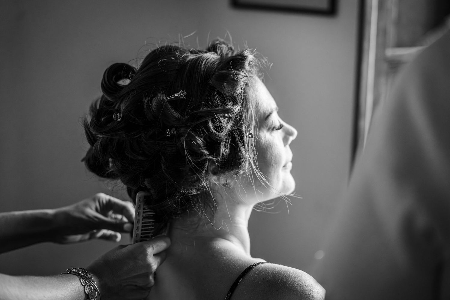 A black and white collage of artistic portrait photographs showing different poses and angles in a studio setting.