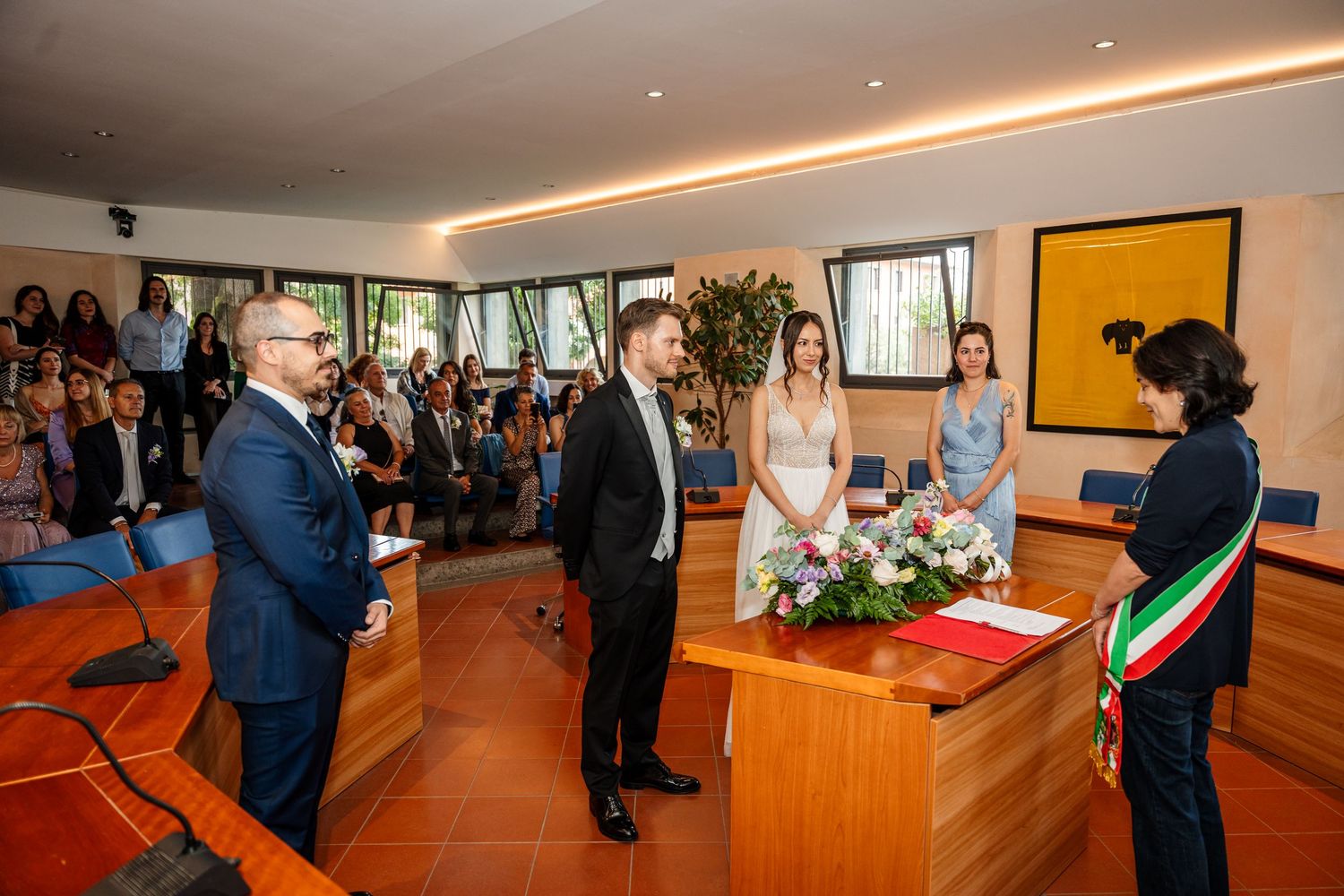 Wedding ceremony with couple exchanging vows before officiant in elegant venue.