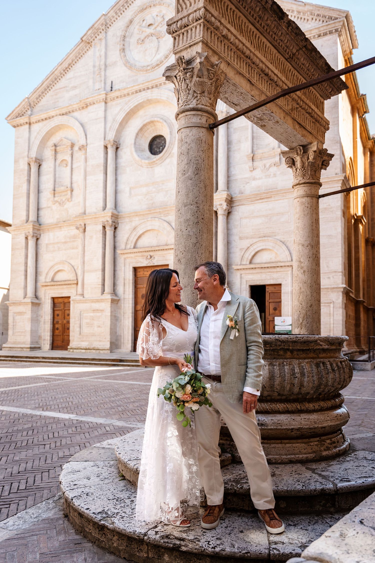 Italian wedding photographer and videographer: this is a photo shoot in the main center of Pienza during an elopement couple session.