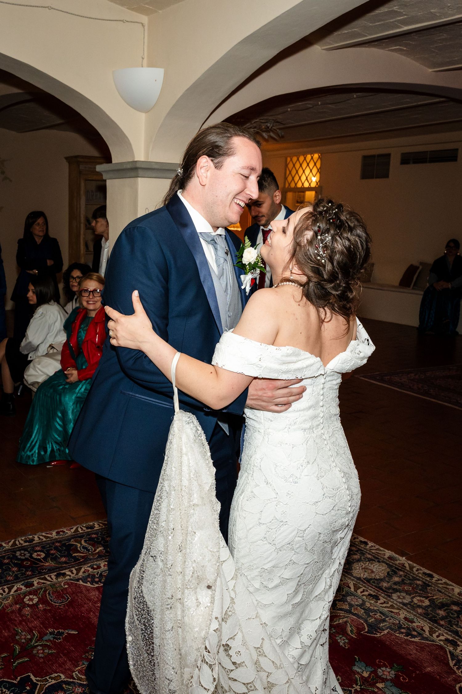 Bride and groom sharing their first dance in a beautifully decorated wedding reception venue.