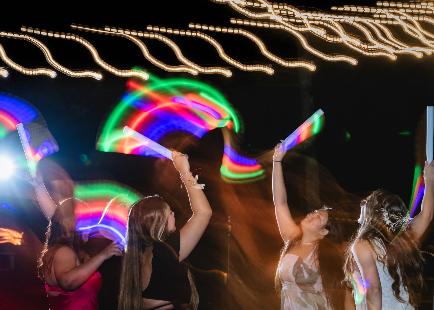 Northern Michigan backyard wedding reception shutter drag photography captured by Karly Walker in Thompsonville, MI