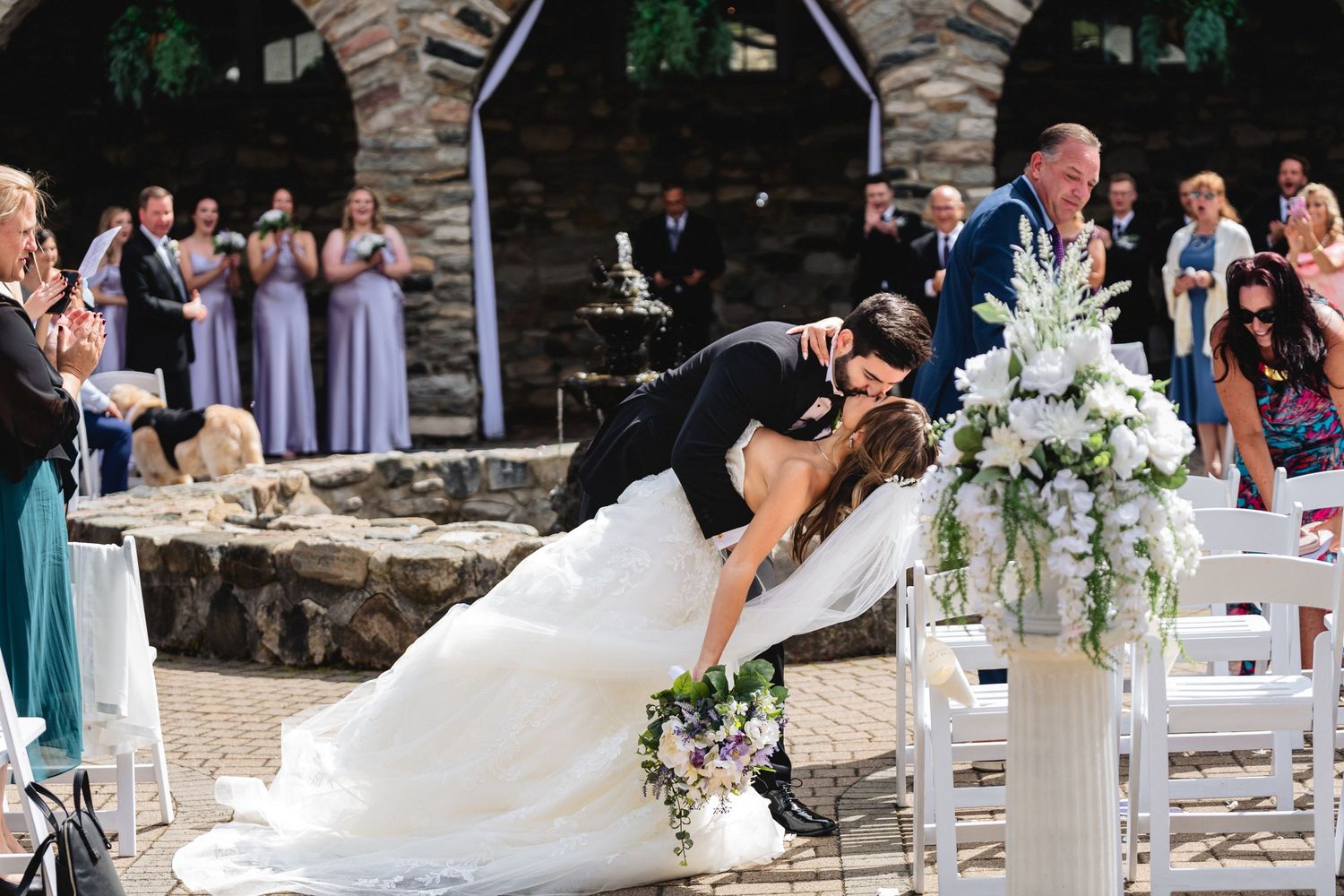 romantic ceremony kiss as captured by Northern Michigan Wedding Photographer Karly Walker of Treehouse Studios at Castle Farms in Charlevoix