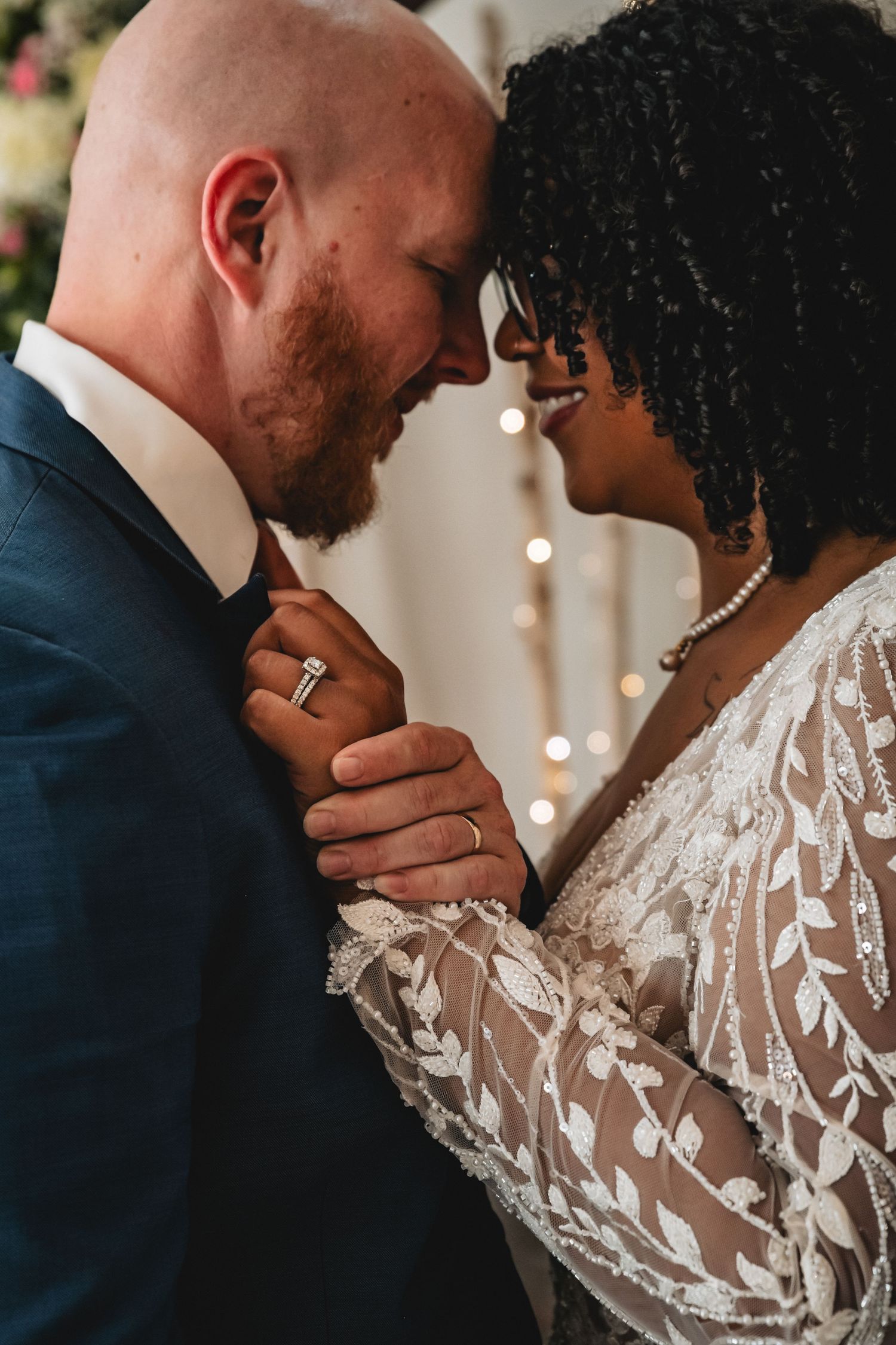 Romantic wedding couple shares intimate moments in a sequence of close-up photos showing tender embraces and lace details.