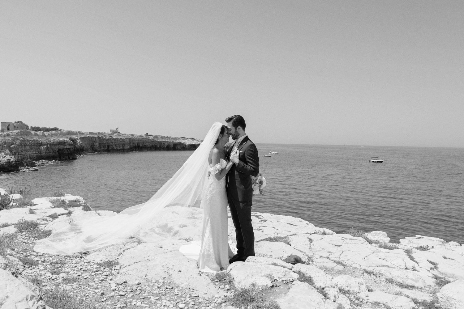 Wedding portraits taken on dramatic white limestone cliffs overlooking the ocean.