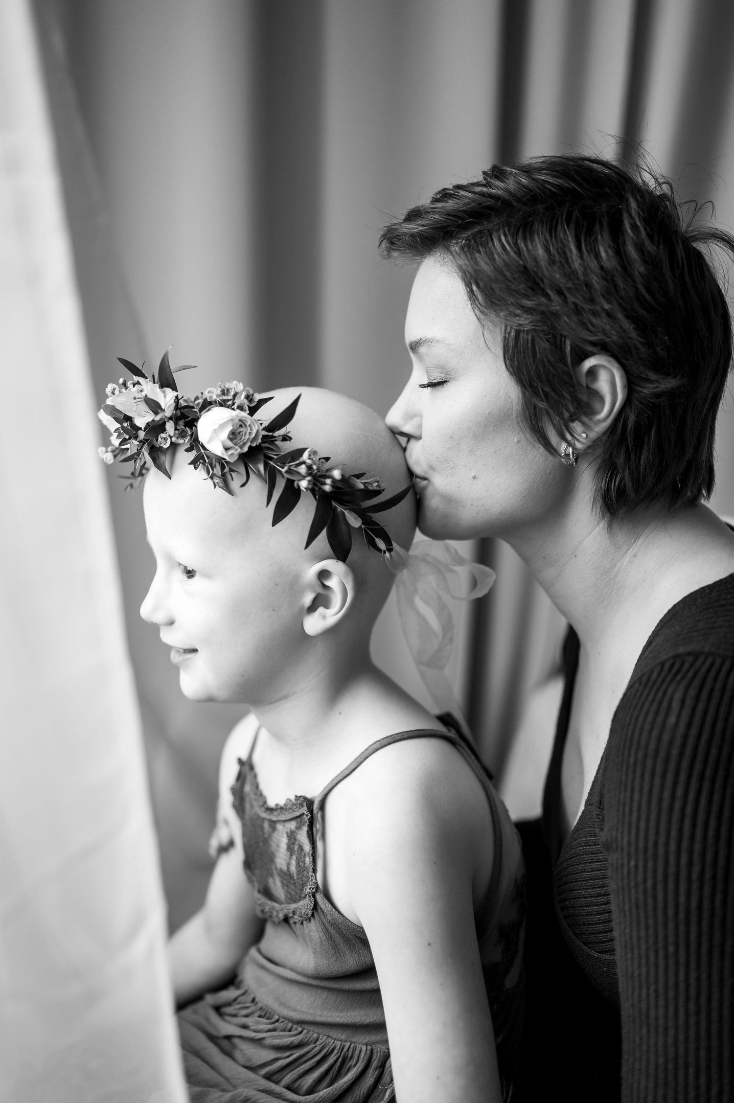 A series of black and white photos showing a person with a leafy branch in profile view against a blurred background.