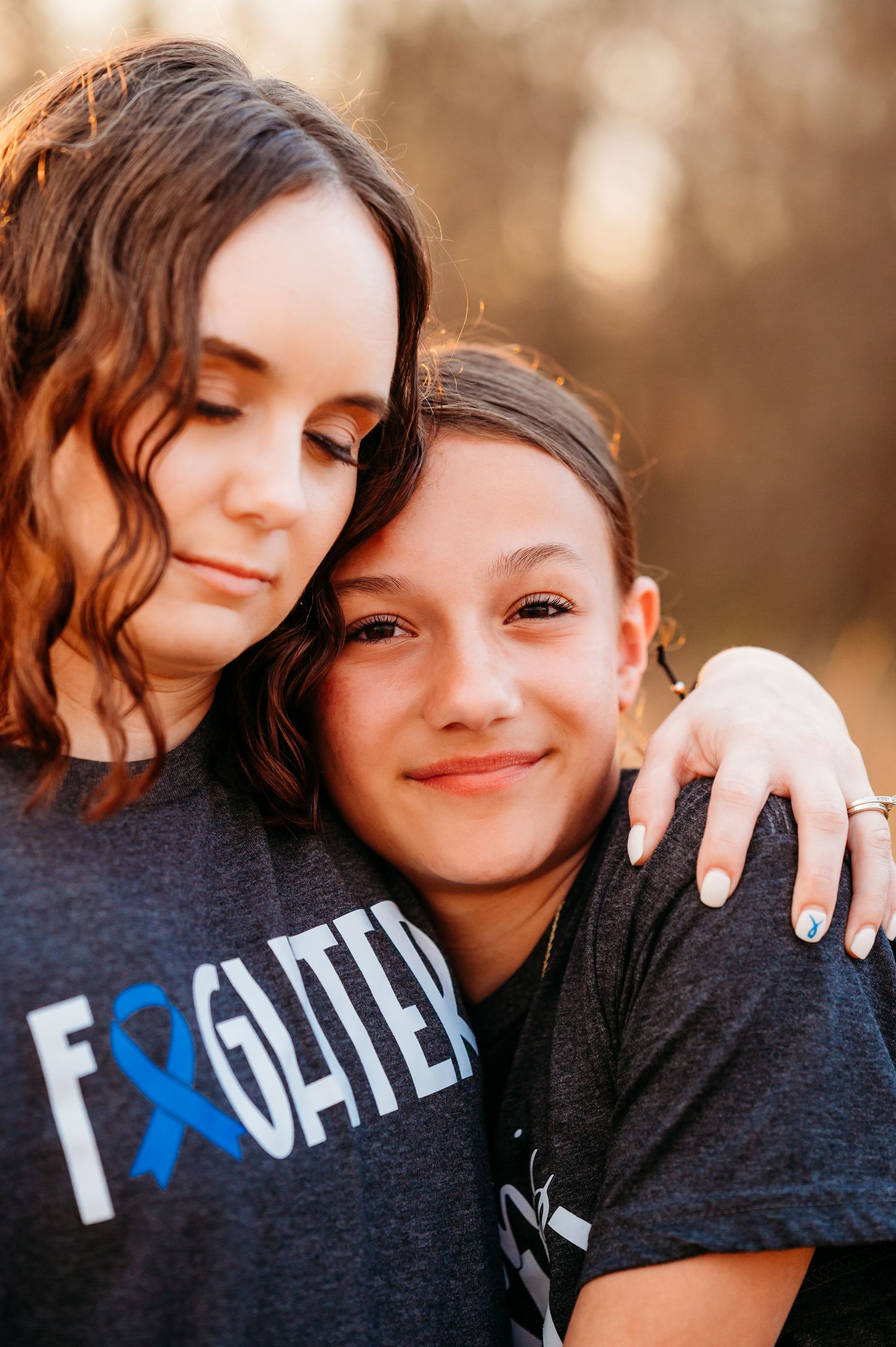 Two people in dark clothing embrace and share affectionate moments across a series of candid photographs.