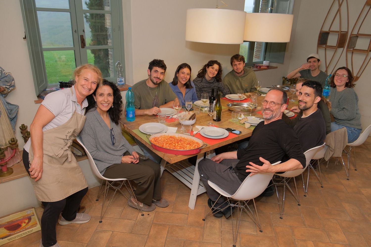“Fun and relaxed family portrait in Italy with kids and parents enjoying authentic moments in Umbria and Tuscany.”