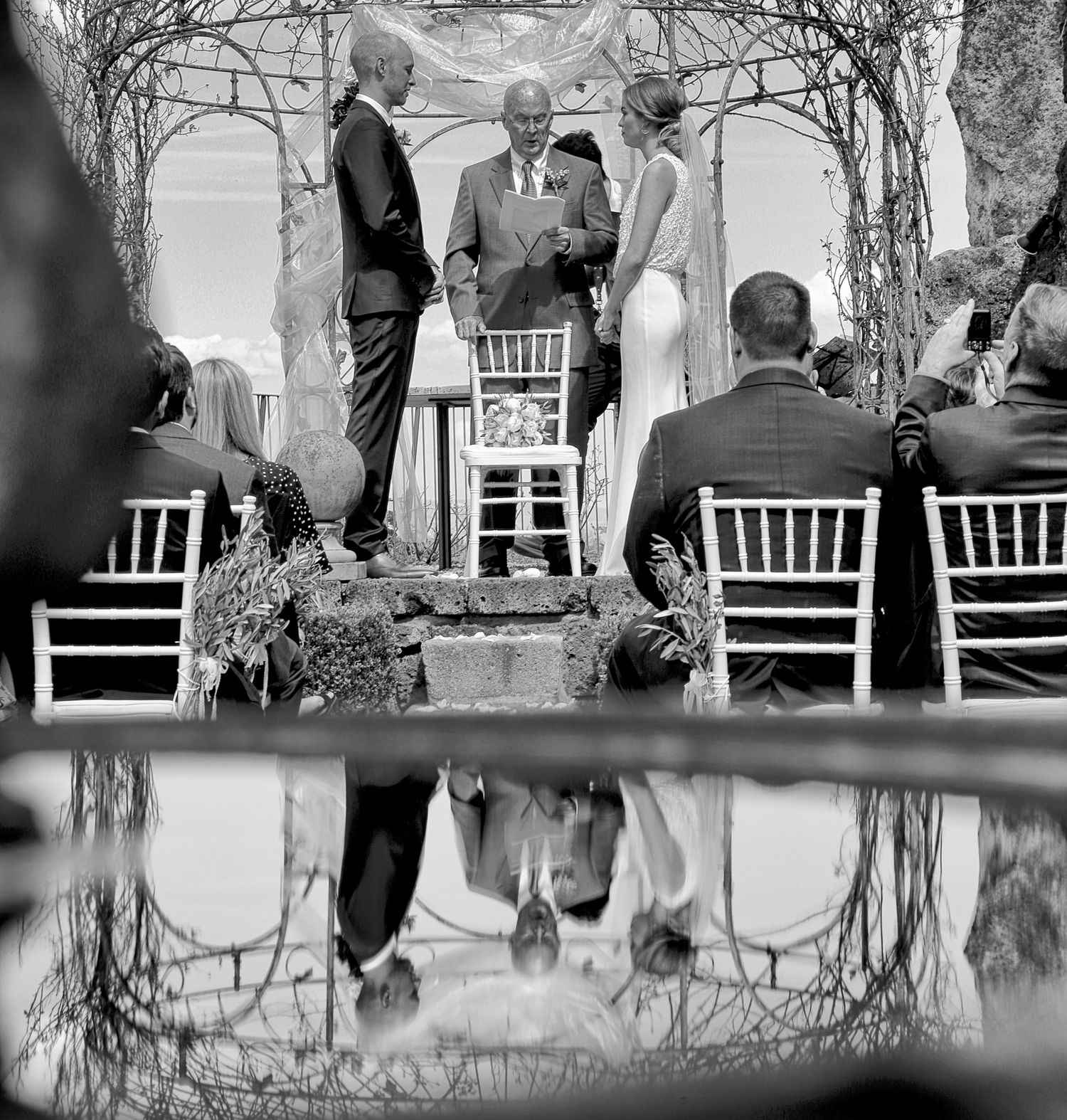 “Fun and joyful wedding photo in Italy capturing natural, playful, and loving moments of the bride and groom.”