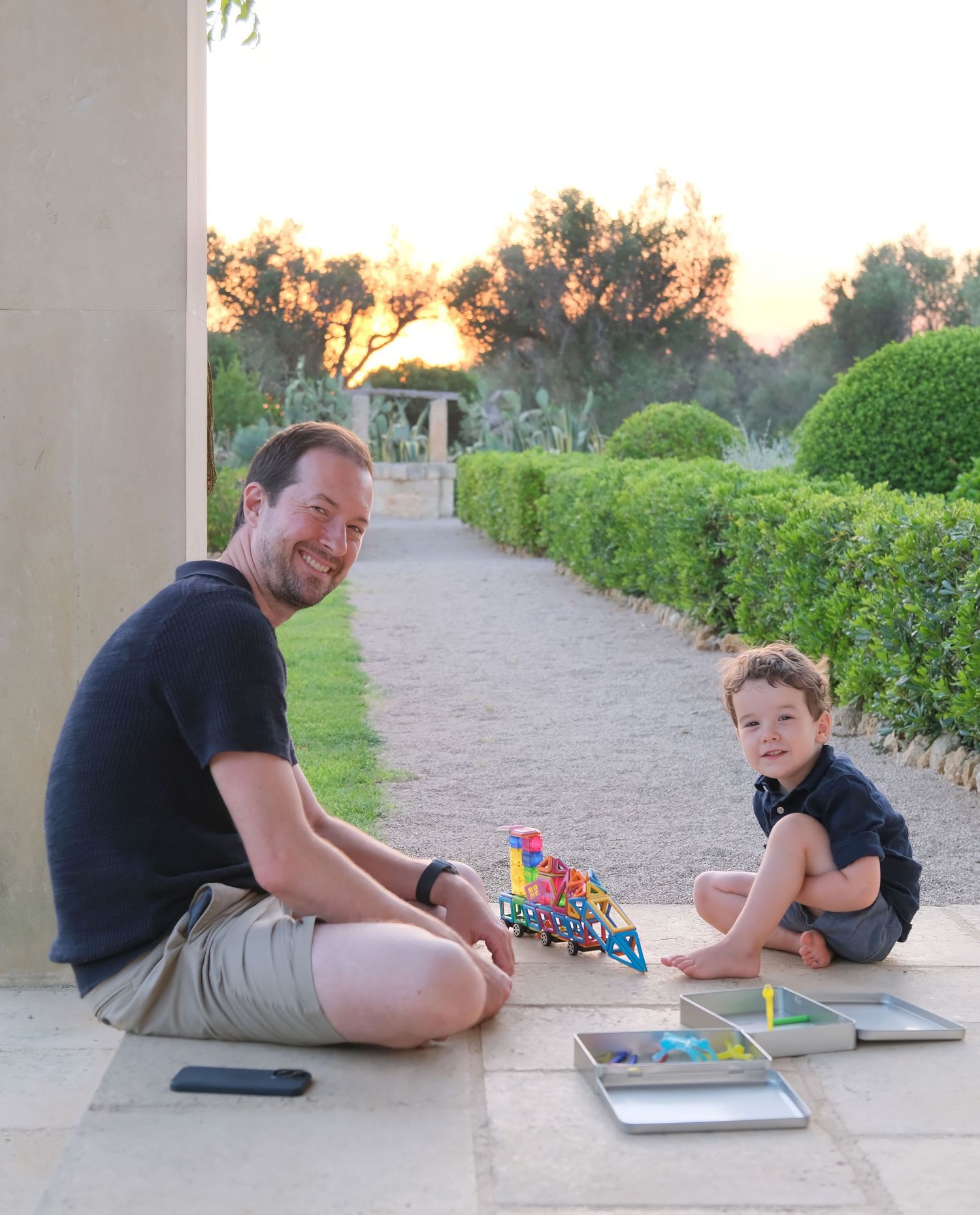 “Relaxed and fun family portrait in Puglia capturing genuine smiles and playful moments.”