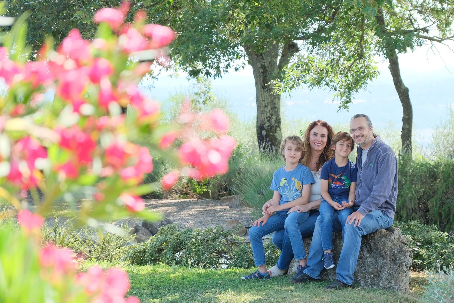 “Fun and relaxed family portrait in Italy with kids and parents enjoying authentic moments in Umbria and Tuscany.”