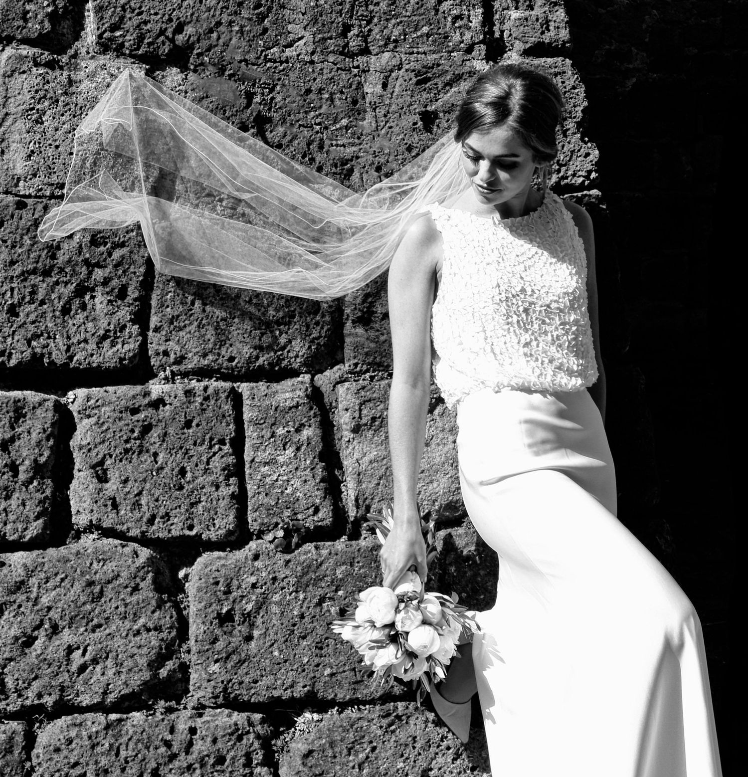 “Fun and joyful wedding photo in Italy capturing natural, playful, and loving moments of the bride and groom.”