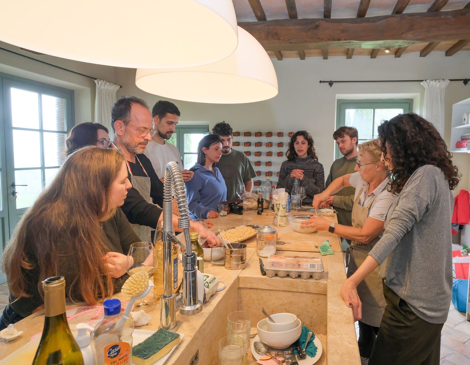 “Fun and relaxed family portrait in Italy with kids and parents enjoying authentic Cooking Class in Umbria and Tuscany.”