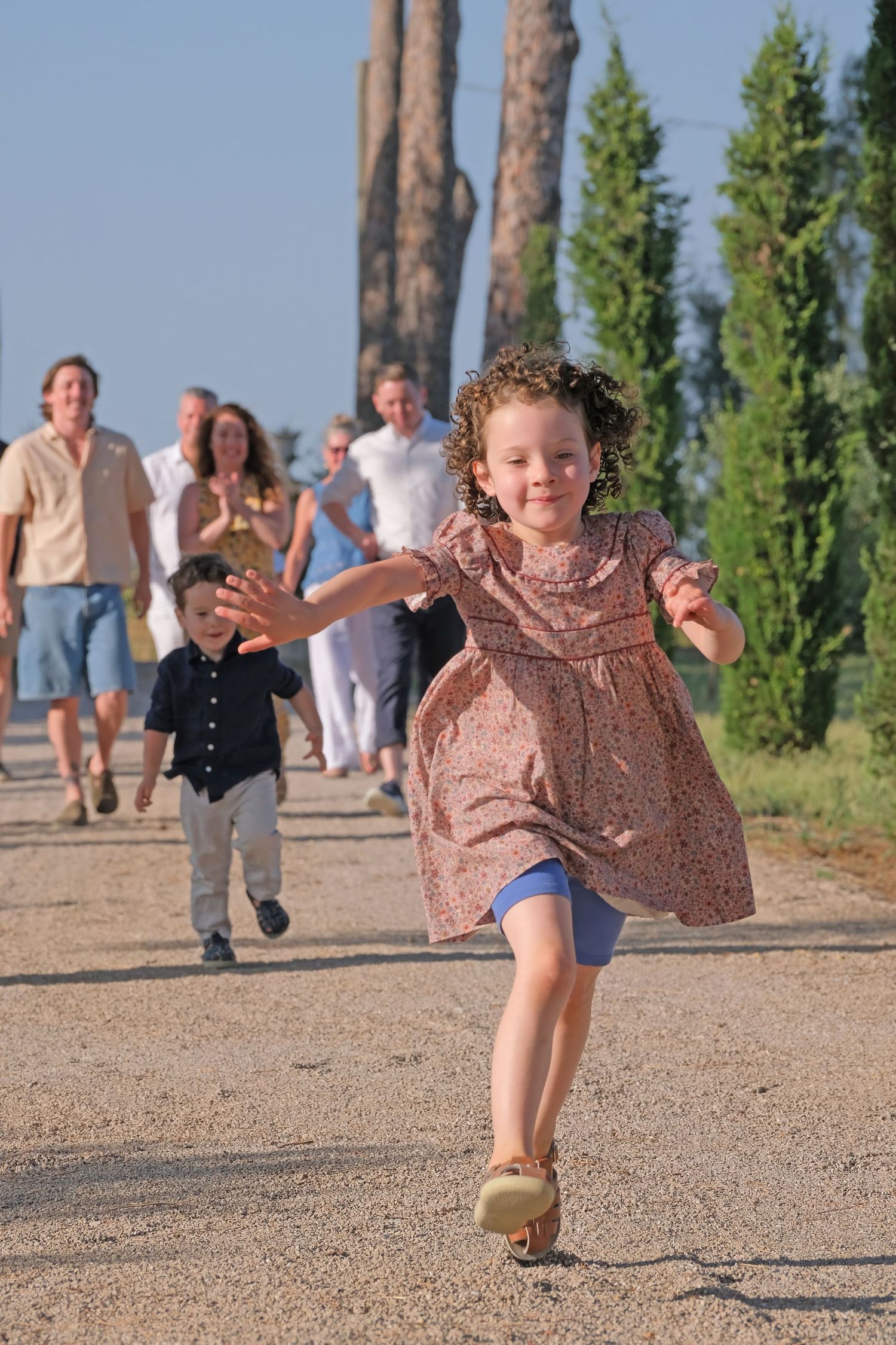 “Lively family photo in Puglia, Italy capturing playful, happy, and natural moments with parents and children.”